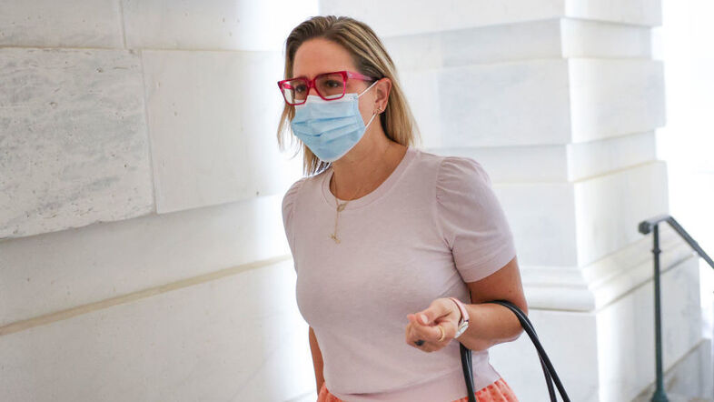 Sen. Kyrsten Sinema, D-Ariz., arrives at the U.S. Capitol on Oct. 5. Her opposition to Democrats' proposed spending package is forcing changes, but her specific positions have been hard to pin down. (Kevin Dietsch/Getty Images)