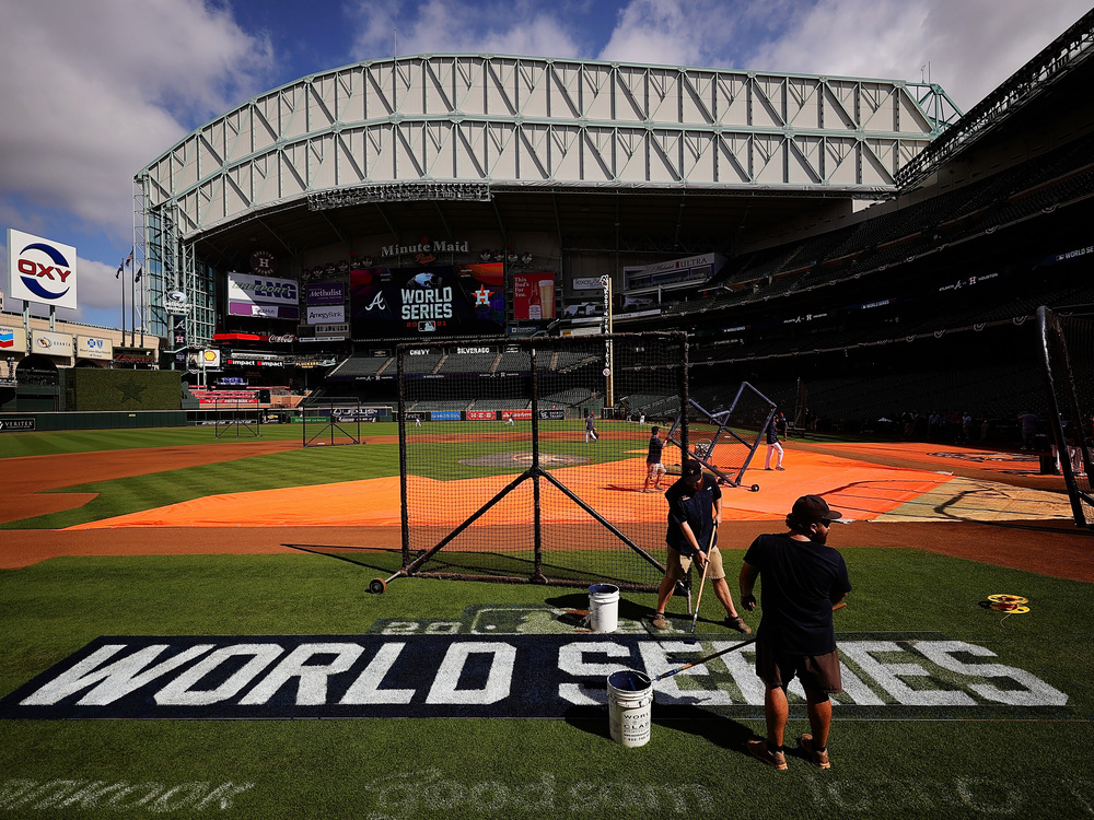 The grounds crew prepares the field during a workout prior to the start of the World Series between the Houston Astros and the Atlanta Braves at Minute Maid Park on Monday in Houston. (Getty Images)