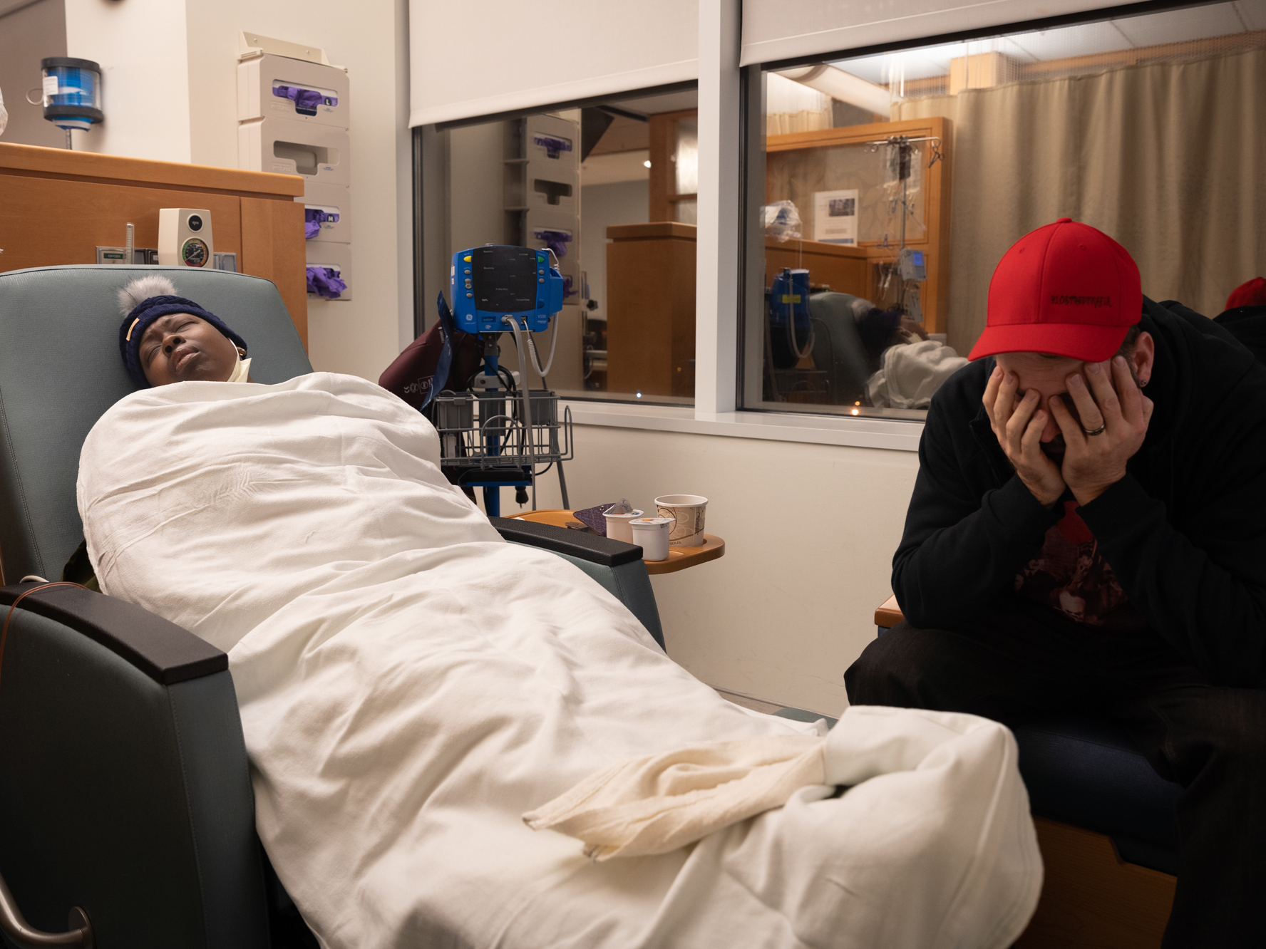 Nunny Reece lays back during chemotherapy while her husband, Scott, waits at the N.C. Cancer Hospital. When Nunny and Scott were informed by a doctor about her diagnosis, "the first thing Scott asked was, is she gonna die," Nunny said. "And, you know, he sat there and cried and I sat there and cried, and you have these two young people and this doctor sitting there with tears in her eyes."