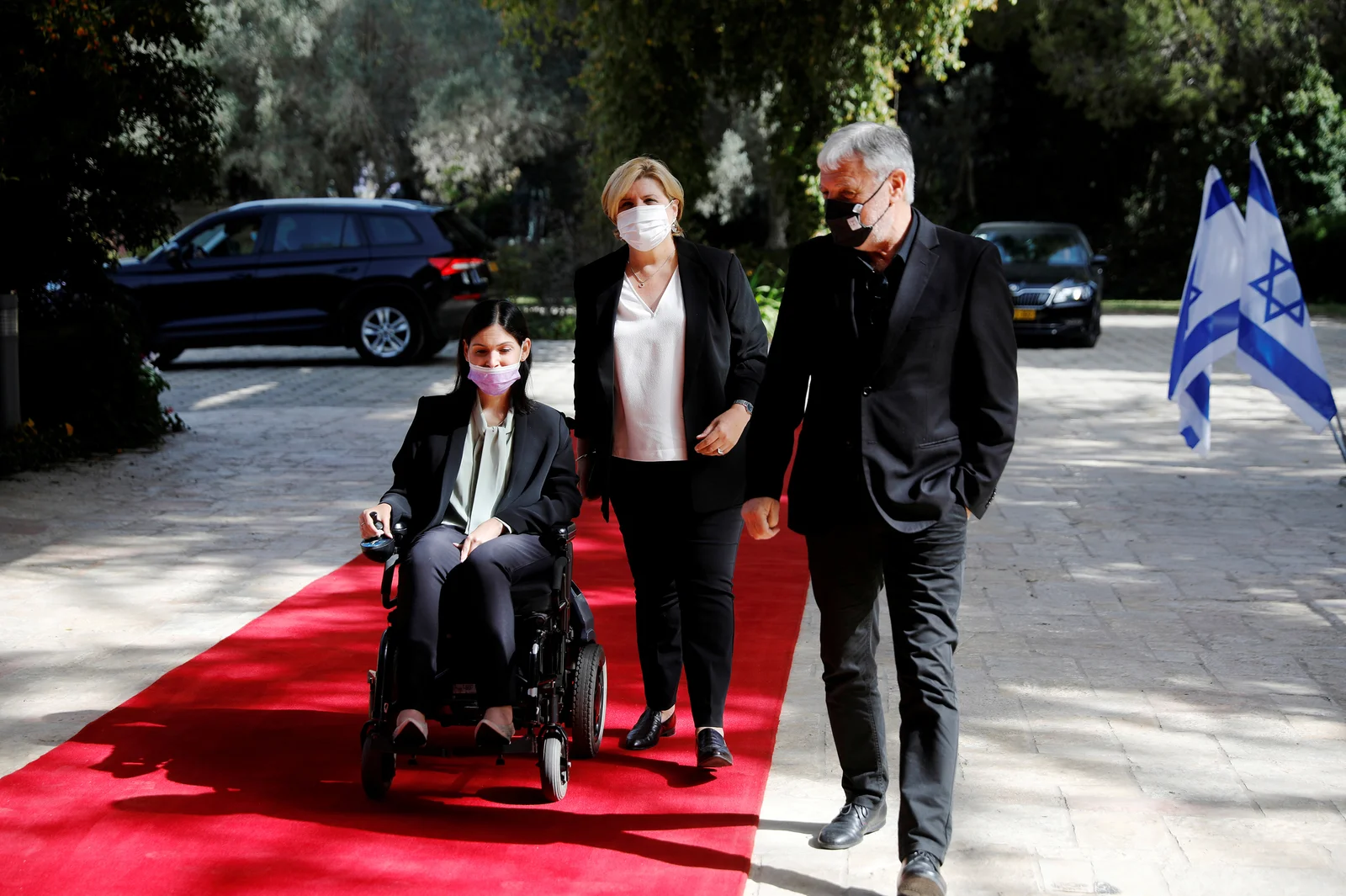 Karine Elharrar, Orna Barbivai and Meir Cohen from the Yesh Atid party arrive for consultations on the formation of a coalition government in Jerusalem on April 5, 2021