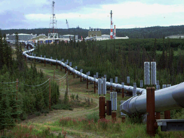 The Biden administration is proposing new regulations to limit climate-warming methane emissions from oil and gas operations and pipelines. This undated file photo shows the Trans-Alaska pipeline and pump station north of Fairbanks.