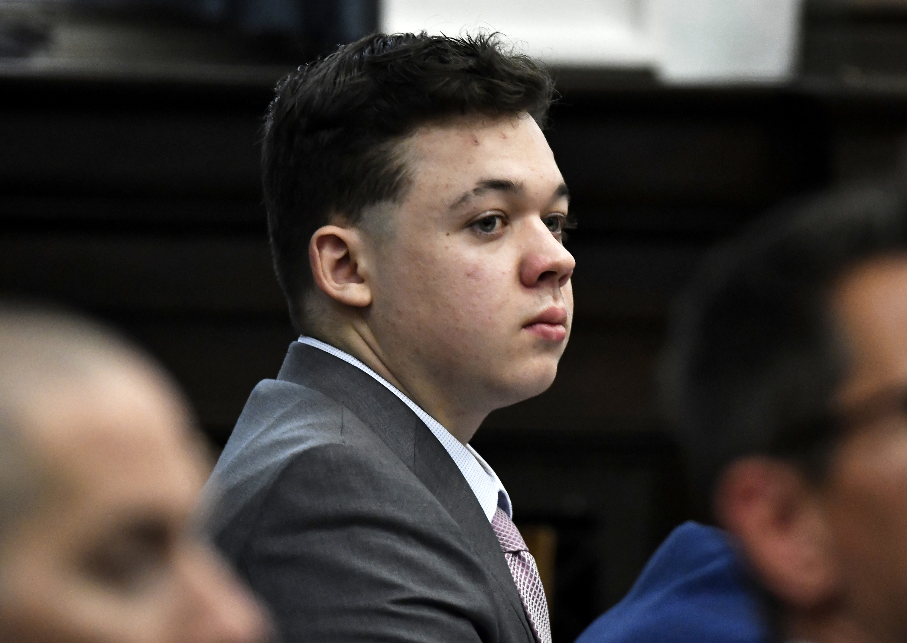 Kyle Rittenhouse shot three demonstrators, killing two of them, during a night of unrest that erupted in Kenosha after a police officer shot Jacob Blake seven times in the back while police attempted to arrest him in August 2020. (Pool/Getty Images)