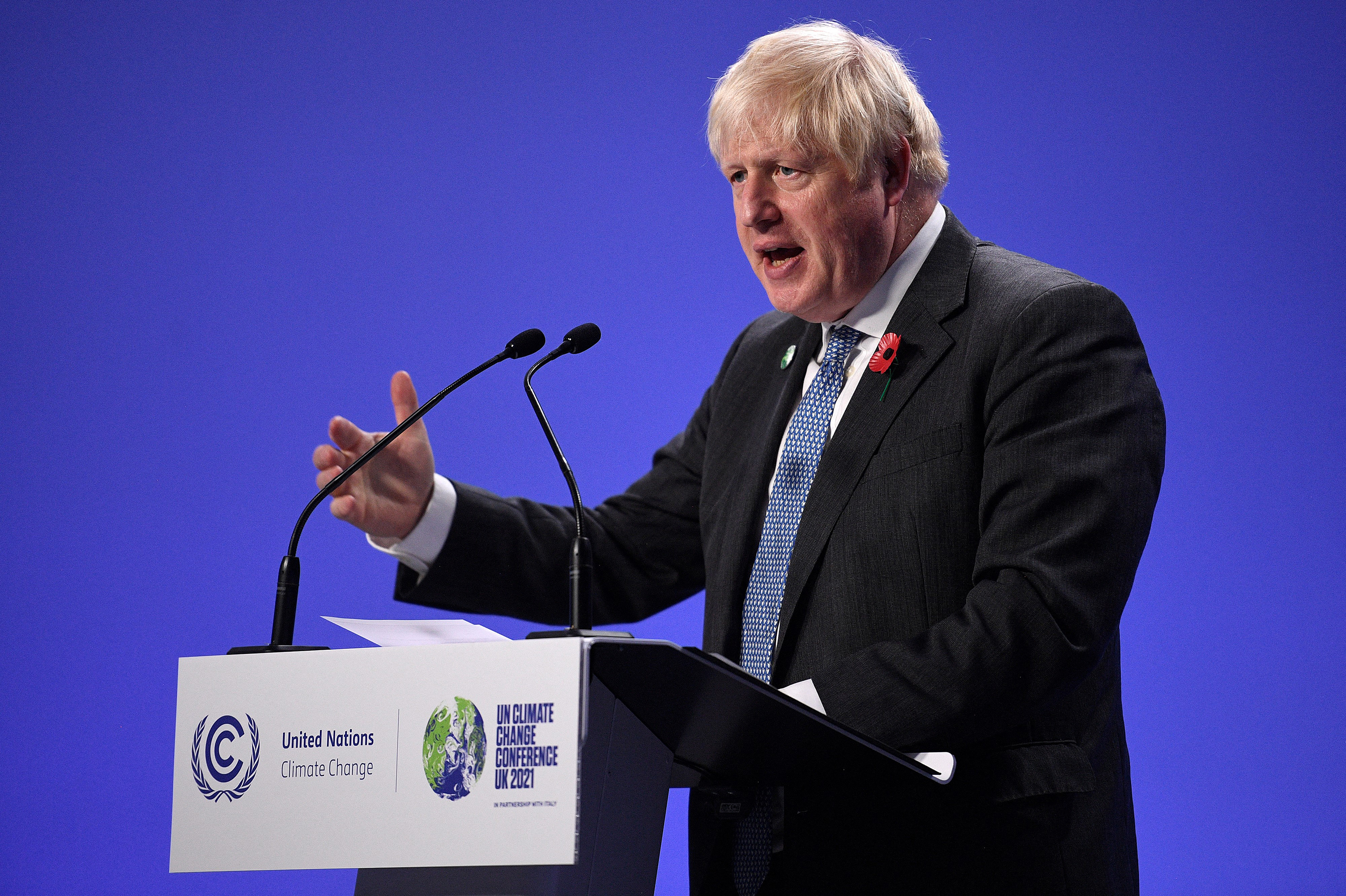 British Prime Minister Boris Johnson speaks during a news conference at the U.N. Climate Change Conference COP26 in Glasgow, Scotland, on Tuesday. (AFP/Getty Images)