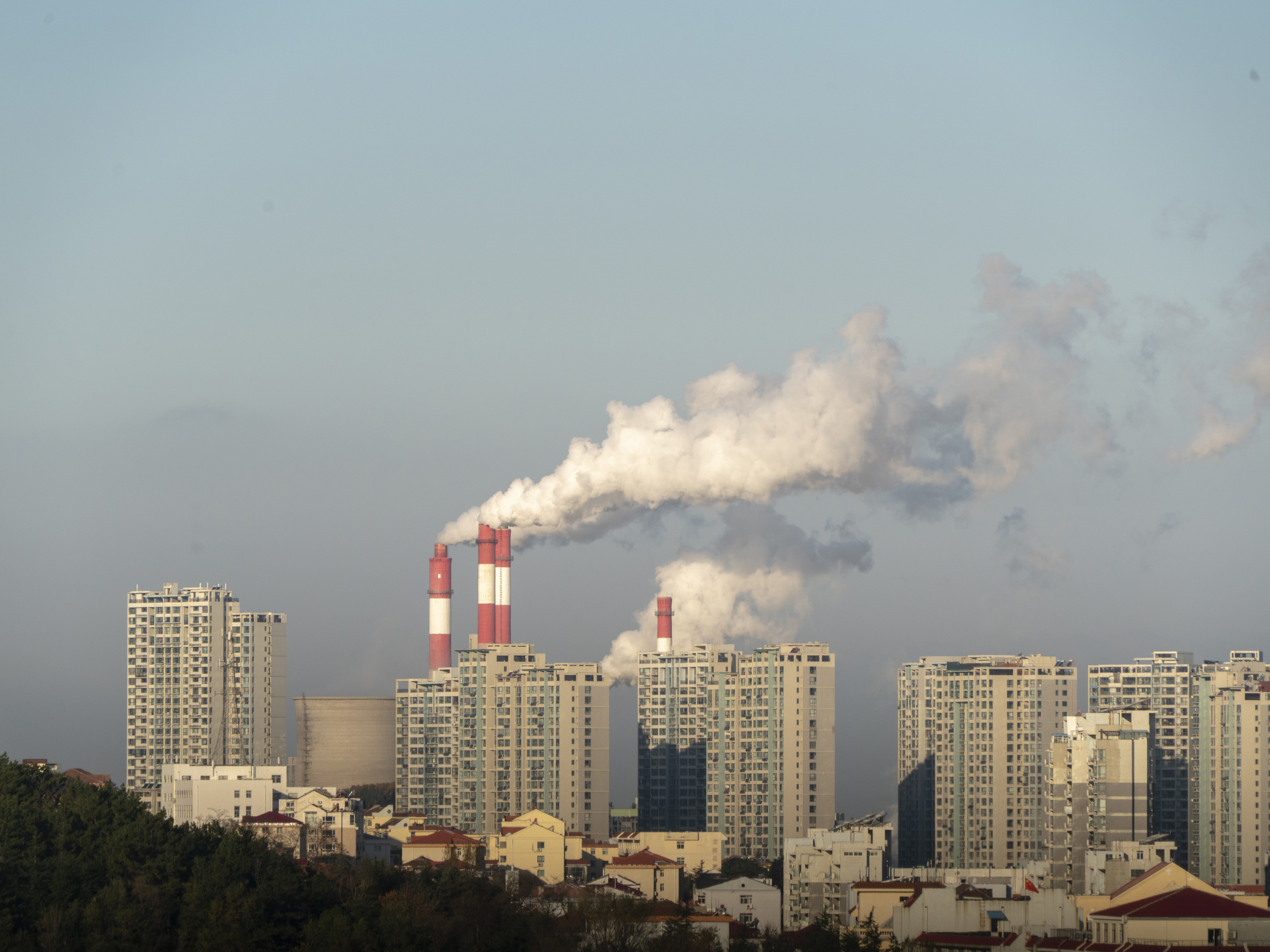 Smokestacks belch in Weihai, in China's Shandong province, in 2019. China is set to surpass pre-pandemic levels of carbon dioxide emissions this year. (LightRocket via Getty Images)