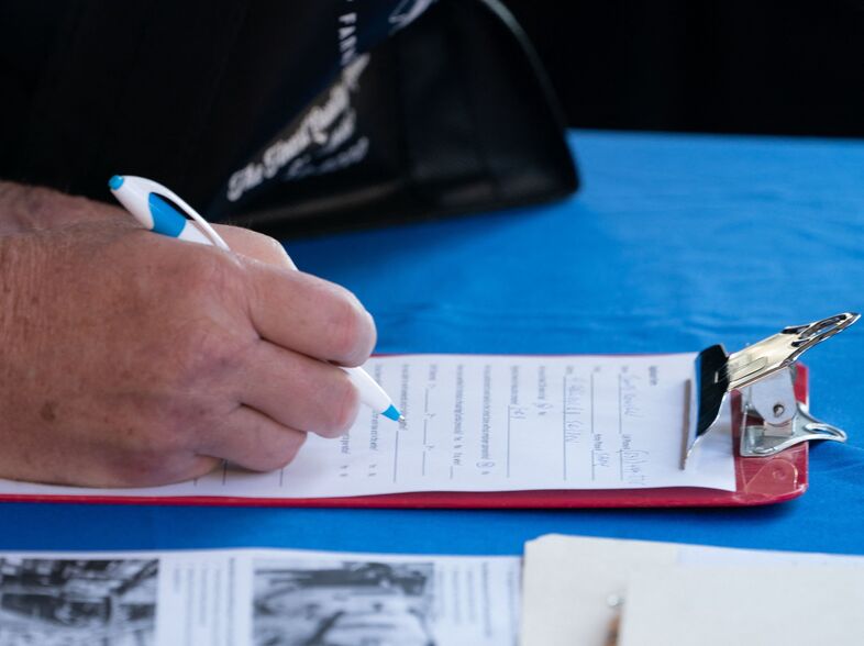 A man fills out an application at a booth at the Employers Only Long Island Food, Beverage and Hospitality Job Fair on Oct. 19 in Melville, N.Y. Employers added 531,000 jobs in October, marking a recovery after two months of weaker job growth. (Bryan R. Smith/AFP via Getty Images)