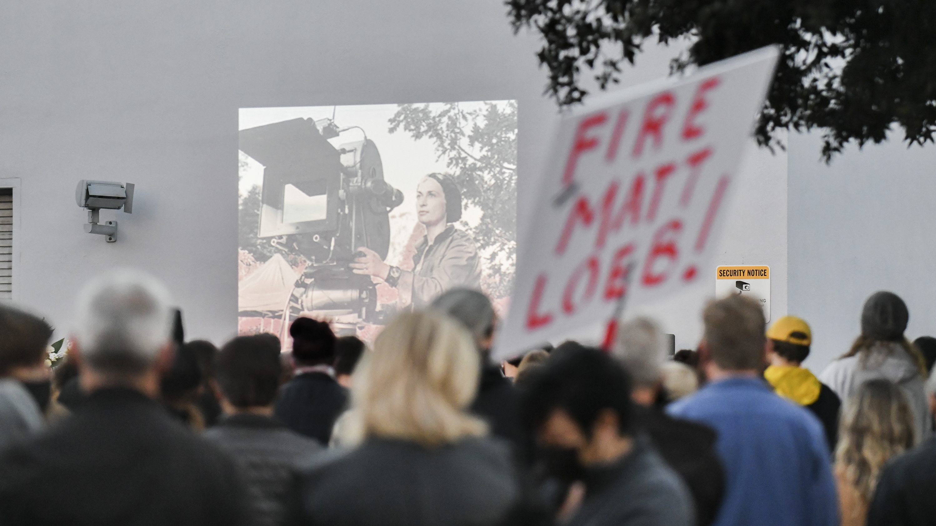 A candlelight vigil is held for Halyna Hutchins at a California IATSE office. Members of the International Alliance of Theatrical Stage Employees union have been pushing for better hours, citing safety concerns, after Hutchins was killed on set. (Getty Images)