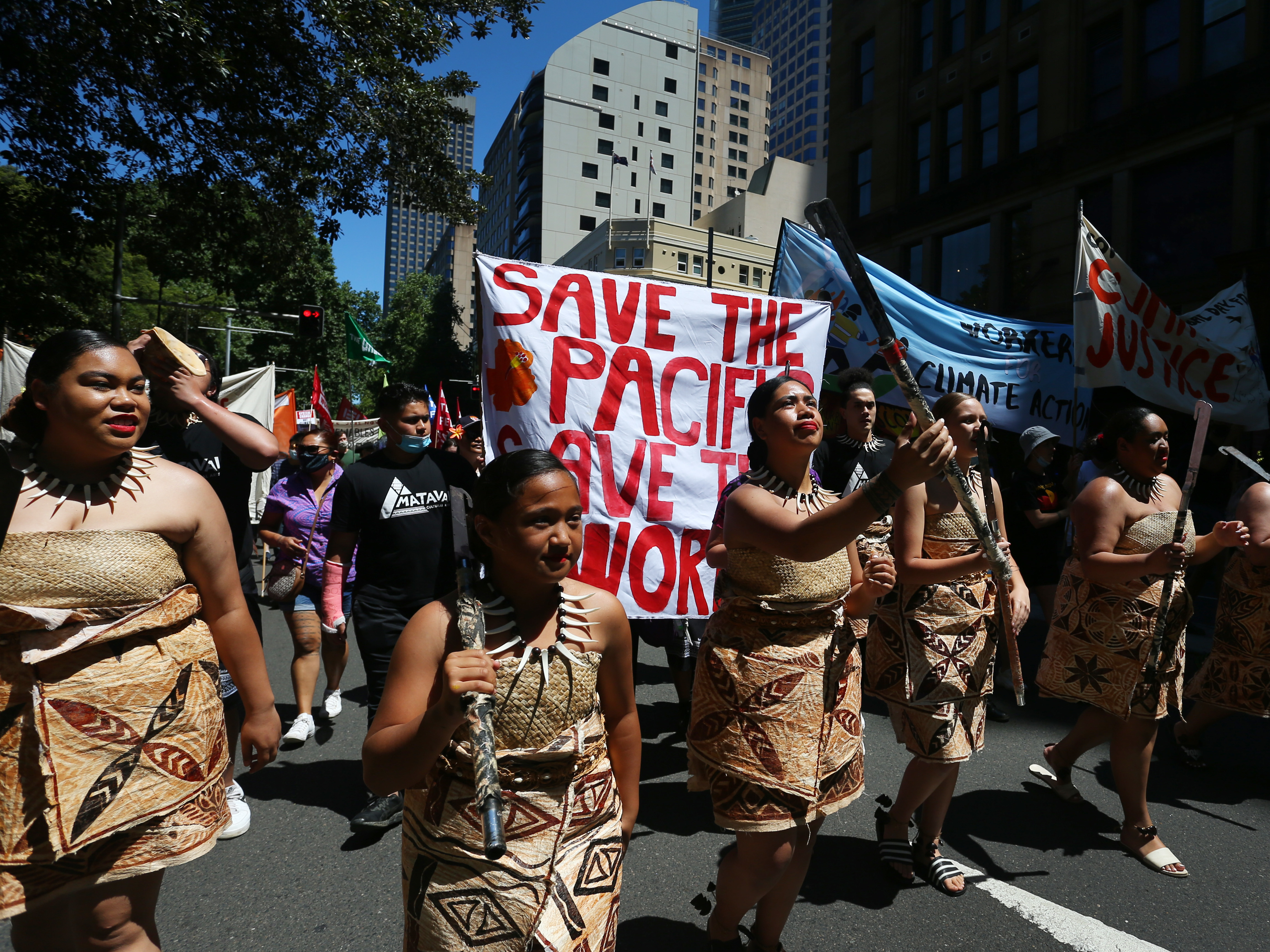 Climate activists march in Sydney during a COP26 protest on Saturday that was one of several demonstrations held around the world. (Getty Images)
