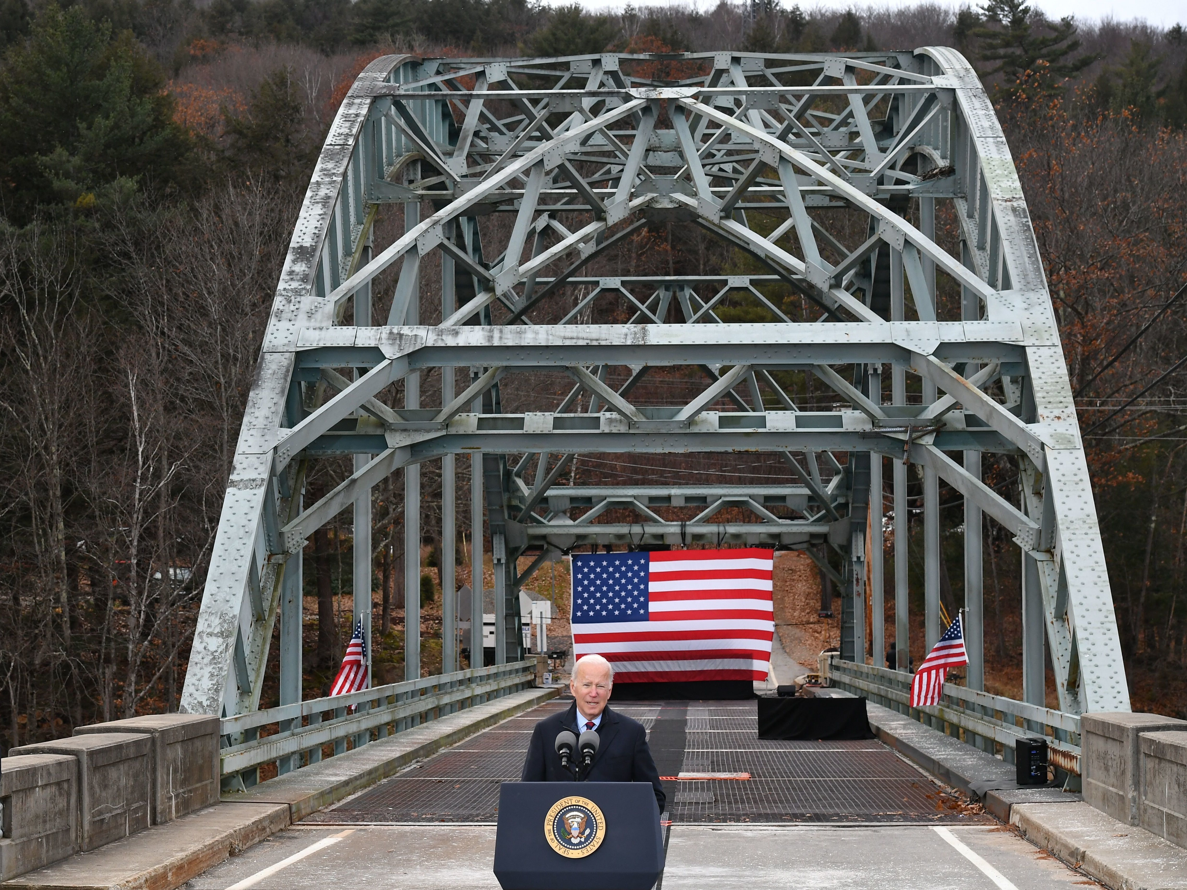 President Biden speaks about his infrastructure bill at a bridge across the Pemigewasset River in Woodstock, N.H., which has been declared structurally unsafe. (AFP via Getty Images)