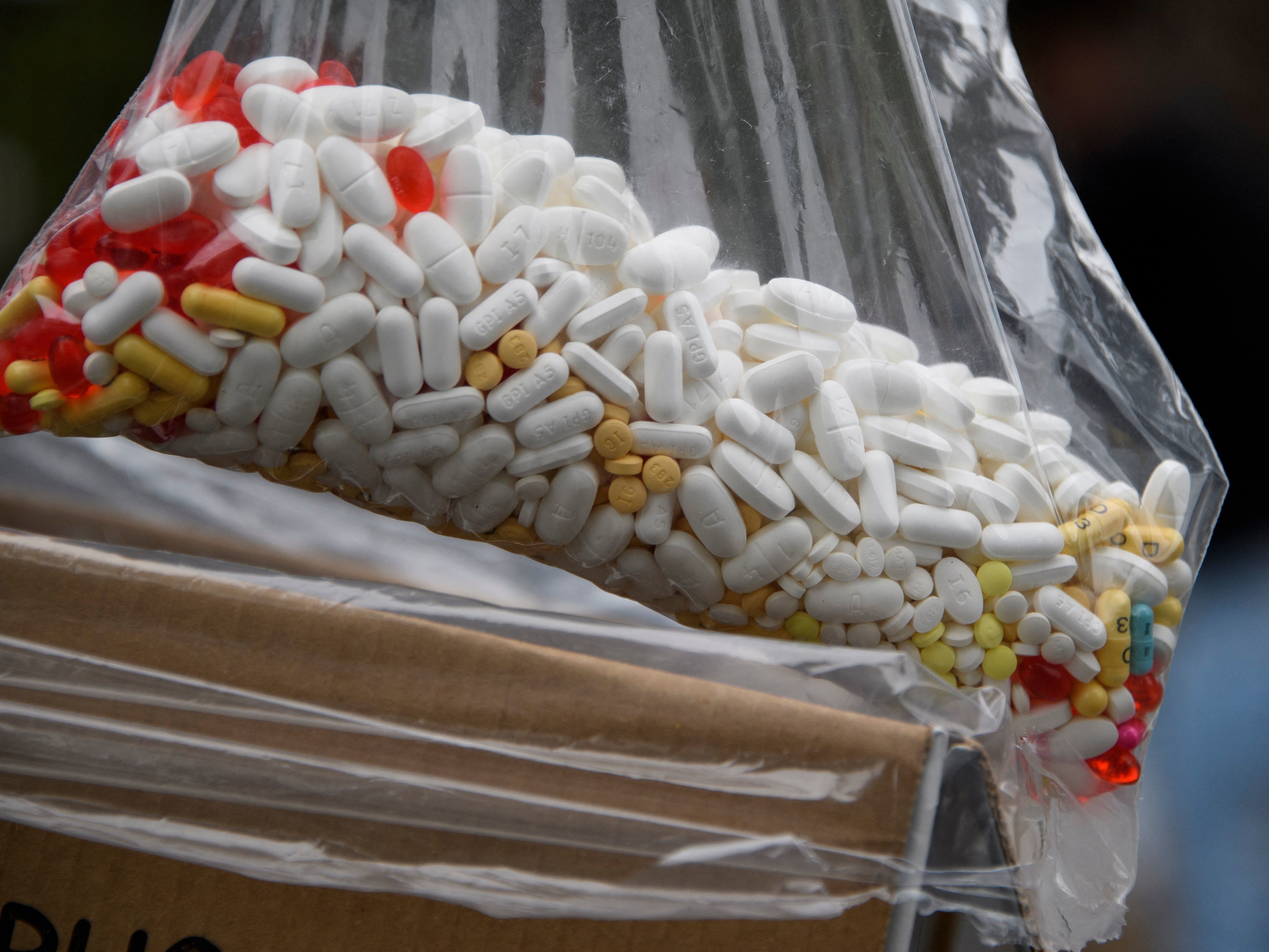 A bag of assorted pills and prescription drugs dropped off for disposal is displayed during the Drug Enforcement Administration's 20th National Prescription Drug Take Back Day earlier this year in Los Angeles. According to the Centers for Disease Control and Prevention, more than  100,000 people died of a drug overdose from April 2020 to April 2021. (AFP via Getty Images)