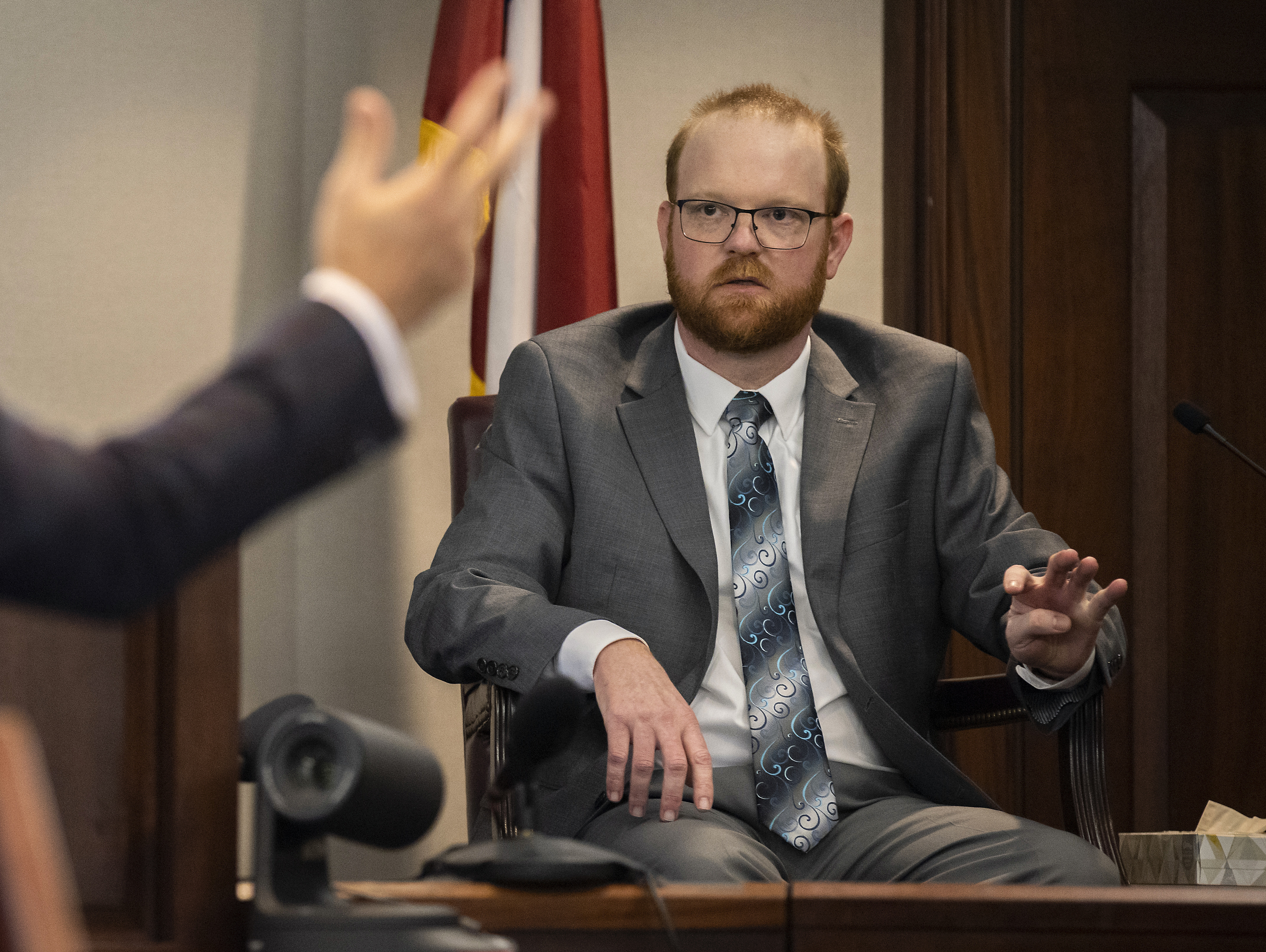 Travis McMichael testified in his murder trial in the Glynn County Courthouse in Brunswick, Ga. He, along with his father, Greg McMichael, and a neighbor, William &quot;Roddie&quot; Bryan, are charged in the February 2020 slaying of 25-year-old Ahmaud Arbery. (Pool / Getty Images)