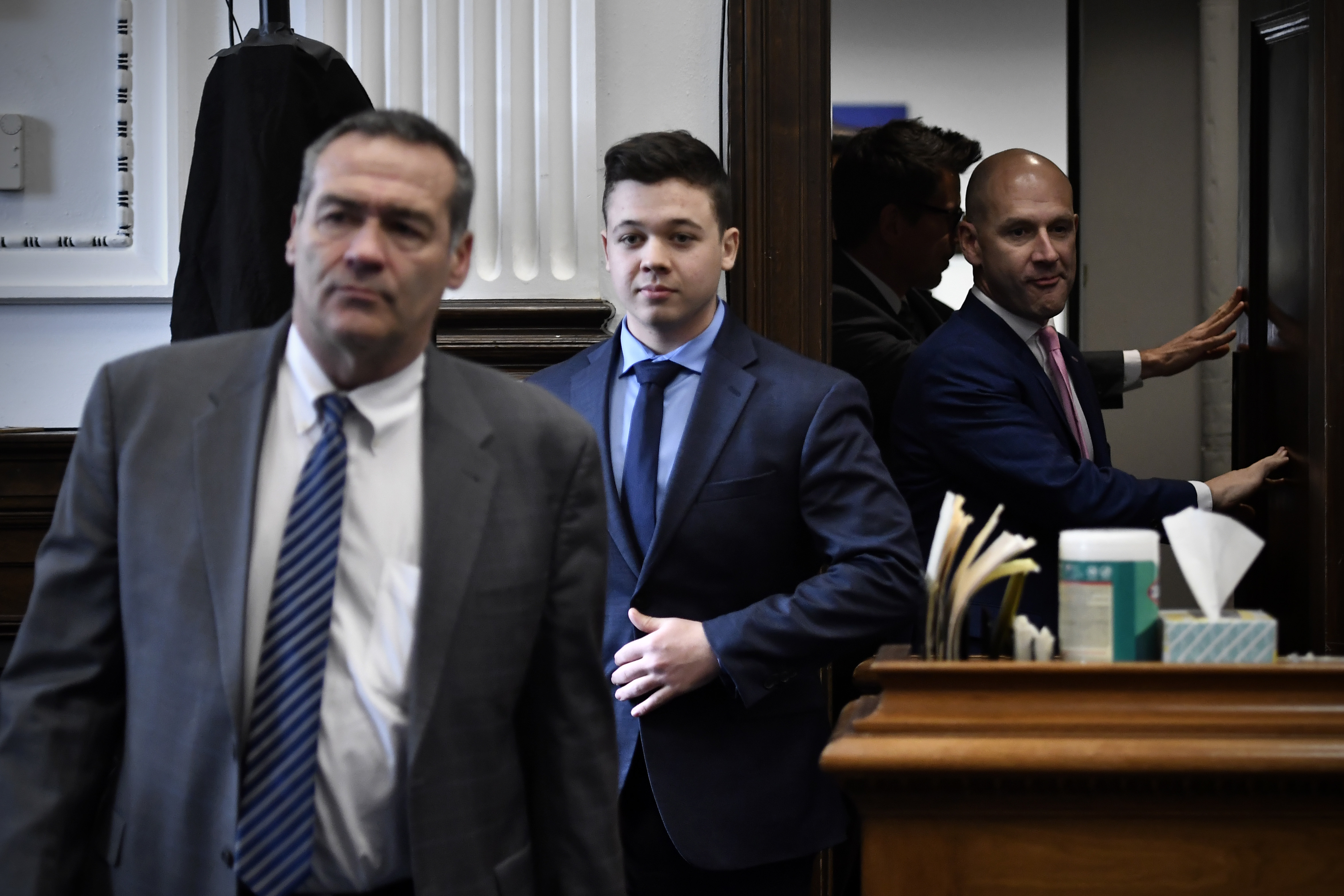 Kyle Rittenhouse, center, enters the courtroom with his attorneys Mark Richards, left, and Corey Chirafisi. (Getty Images)