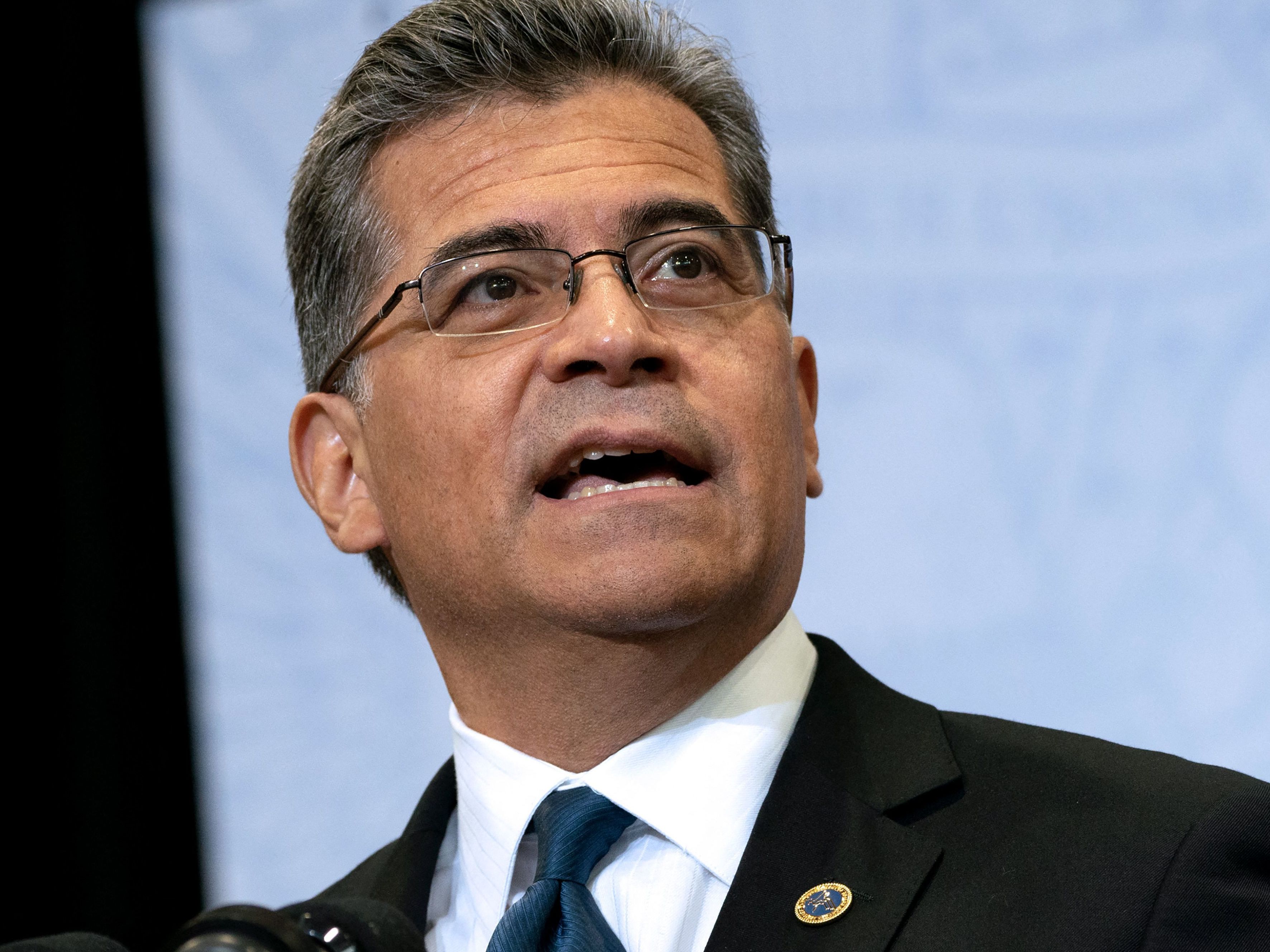 HHS Secretary Xavier Becerra says doctors who are balking at the rules of the No Surprises Act aren't looking out for patients. &quot;I don't think when someone is overcharging that it's going to hurt the overcharger to now have to [accept] a fair price,&quot; Becerra says. The Congressional Budget Office estimates the Biden team's rules would push insurance premiums down by 0.5% to 1%. (AFP via Getty Images)
