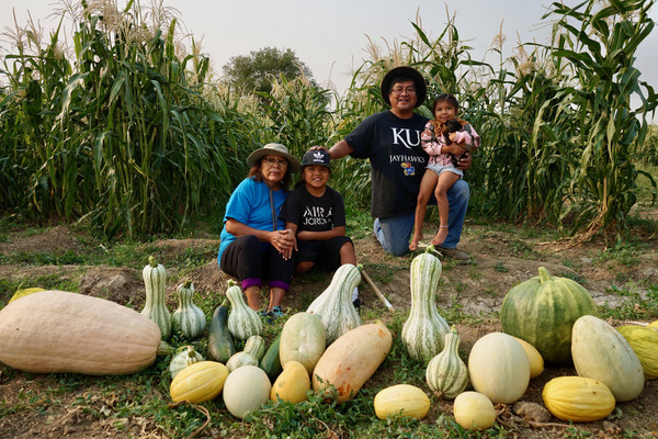 Native tribes have responded to the pandemic with creative ways to stay connected. Veronica Concho and Raymond Concho Jr. grew traditional Pueblo foods and Navajo crops with their grandchildren Kaleb and Kateri Allison-Burbank in Waterflow, N.M.