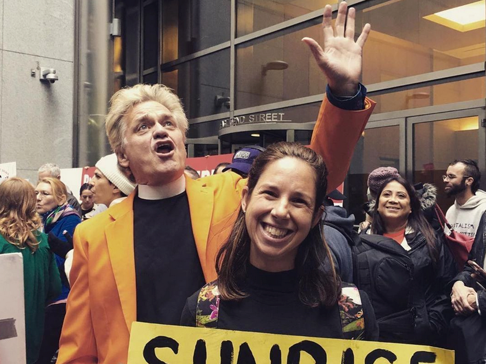 Reverend Billy (William Talen, left) among a flock of supporters. (Courtesy of Reverend Billy and The Church of Stop Shopping)
