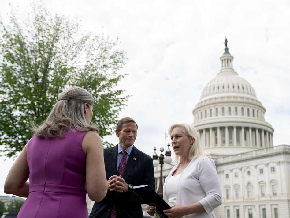Sen. Kirsten Gillibrand, D-N.Y., (right), speaks to Sen. Richard Blumenthal, D-Conn., and Sen. Joni Ernst, R-Iowa, following an April 29 news conference on the Military Justice Improvement and Increasing Prevention Act. (Stefani Reynolds/Getty Images)