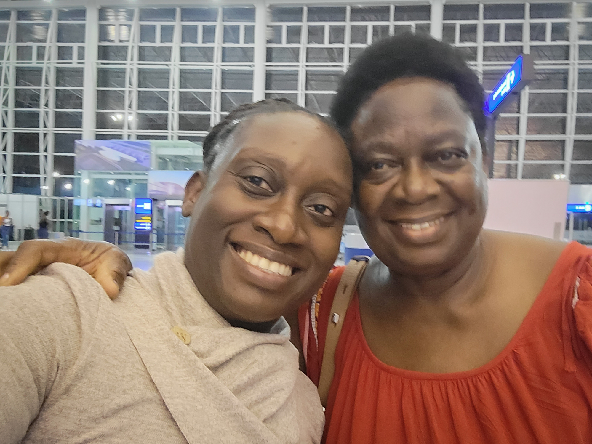 Jacqueline Muna Musiitwa, left, and her mom, Anne Sikwibele, at the airport in Lusaka, Zambia, in November. Musiitwa, who lives in Washington, D.C., is worried that her mom may not be able to visit the U.S. for Christmas. In an effort to stem the spread of the omicron variant, several nations have imposed travel bans on southern African nations, which are in a state of flux. (Jacqueline Muna Musiitwa)