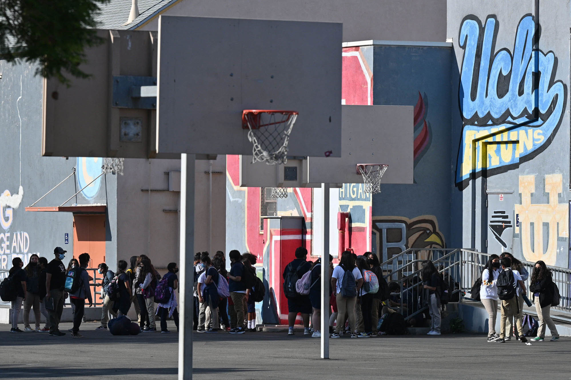 Students walk to their classrooms at a public middle school in Los Angeles, California, September 10, 2021. (AFP via Getty Images)