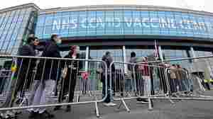 As omicron surges, nations announce rules on gatherings and travel ahead of holidays