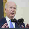 Biden announces free tests and defends the White House response as COVID cases surge