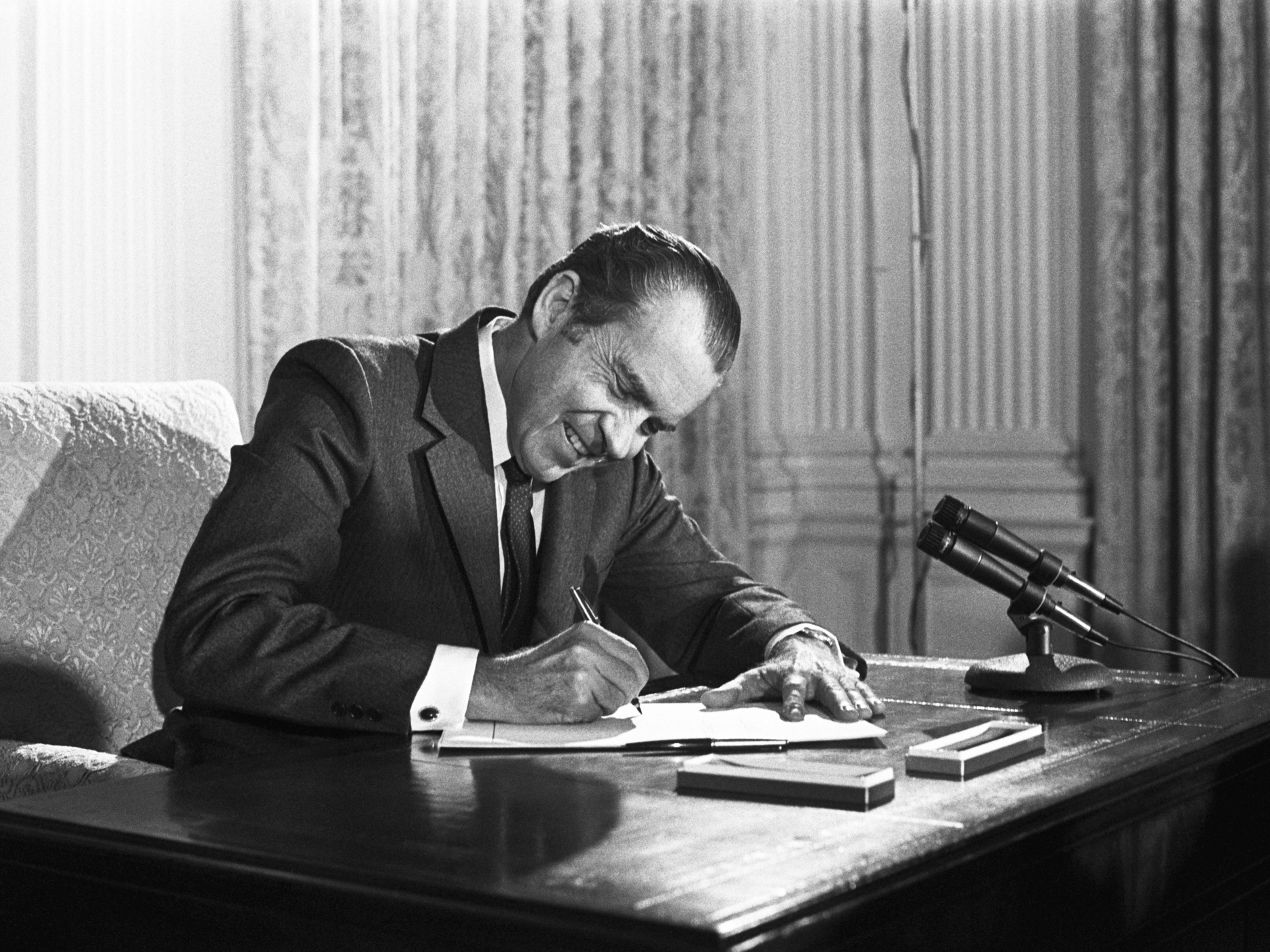 Richard Nixon signs the National Cancer Act at the White House on Dec. 23, 1972. It provided $1.6 billion to find the causes of cancer and find new treatments. (Bettmann Archive/Getty Images)