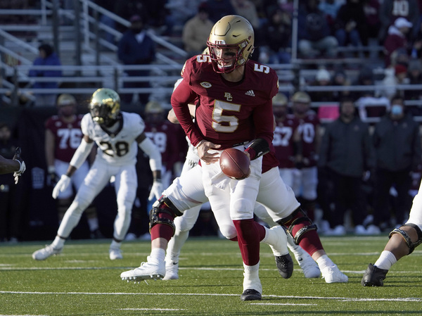 Boston College quarterback Phil Jurkovec prepares to hand the ball off during a game earlier this season. The team had to withdraw from the Military Bowl because of the pandemic.