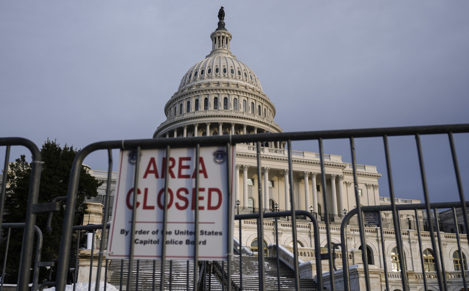 Security fences are positioned near the West Front of the U.S. Capitol on Wednesday, a day ahead of the first anniversary of the Jan. 6 insurrection. (Drew Angerer/Getty Images)