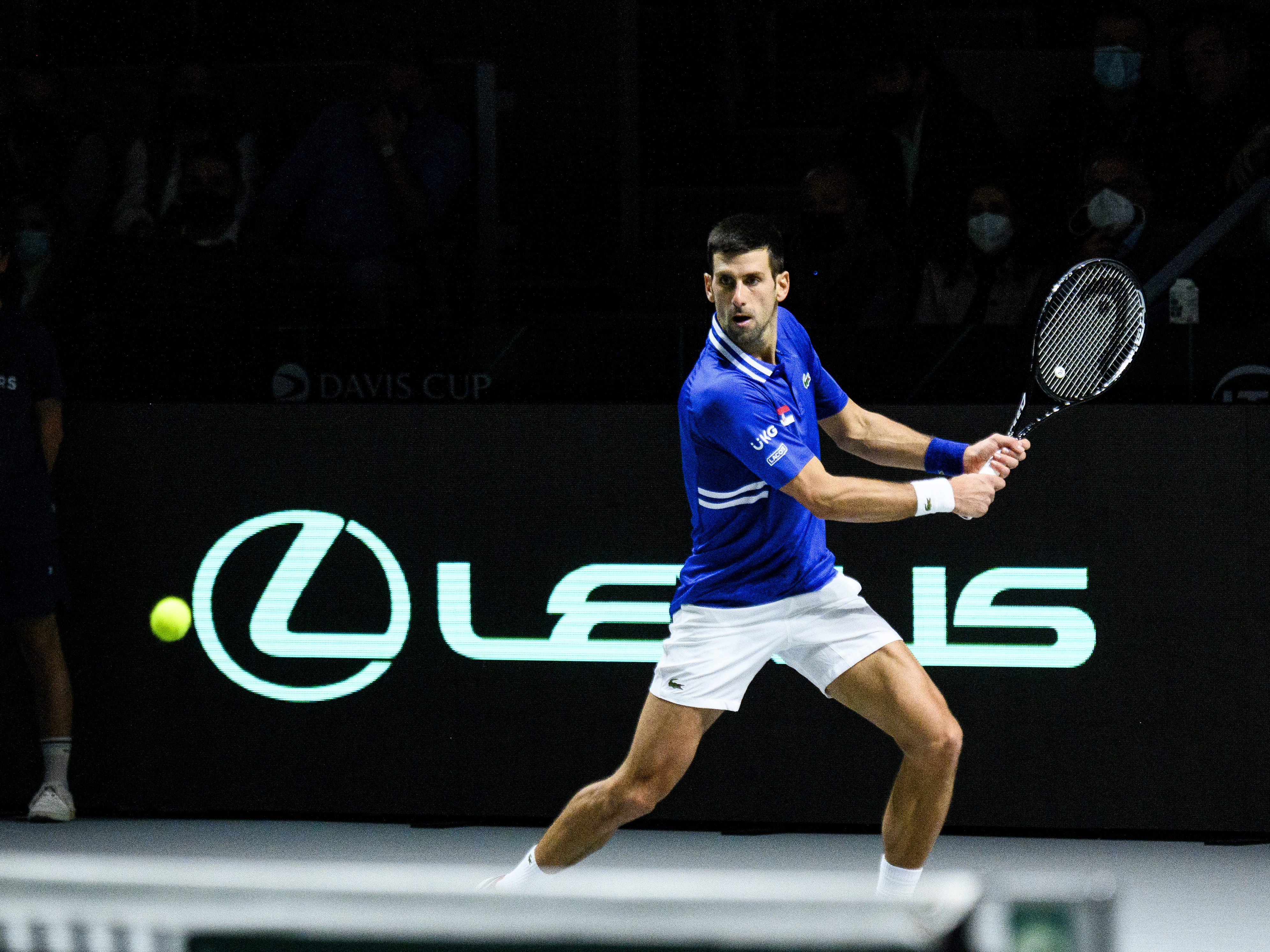 Novak Djokovic of Serbia plays a backhand against Marin Cilic of Croatia during the Davis Cup Semi Final match between Croatia and Serbia at Madrid Arena pavilion in December in Madrid, Spain. (Getty Images for Lexus)