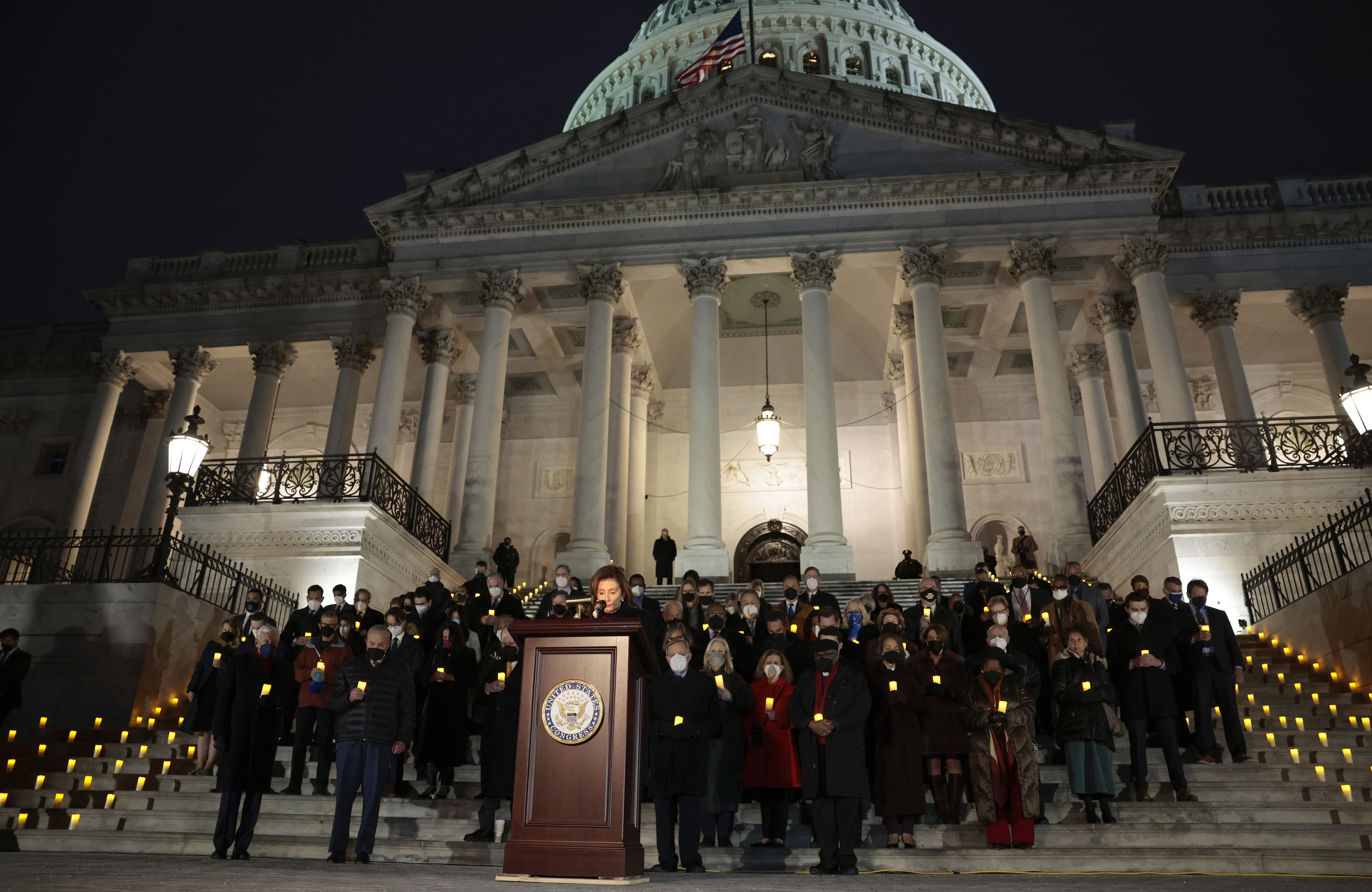 House Speaker Nancy Pelosi, D-Calif., pauses for a moment of silence alongside fellow lawmakers and congressional staff members during a vigil Thursday evening to commemorate the anniversary of the Jan. 6 attack on the U.S. Capitol. (Getty Images)