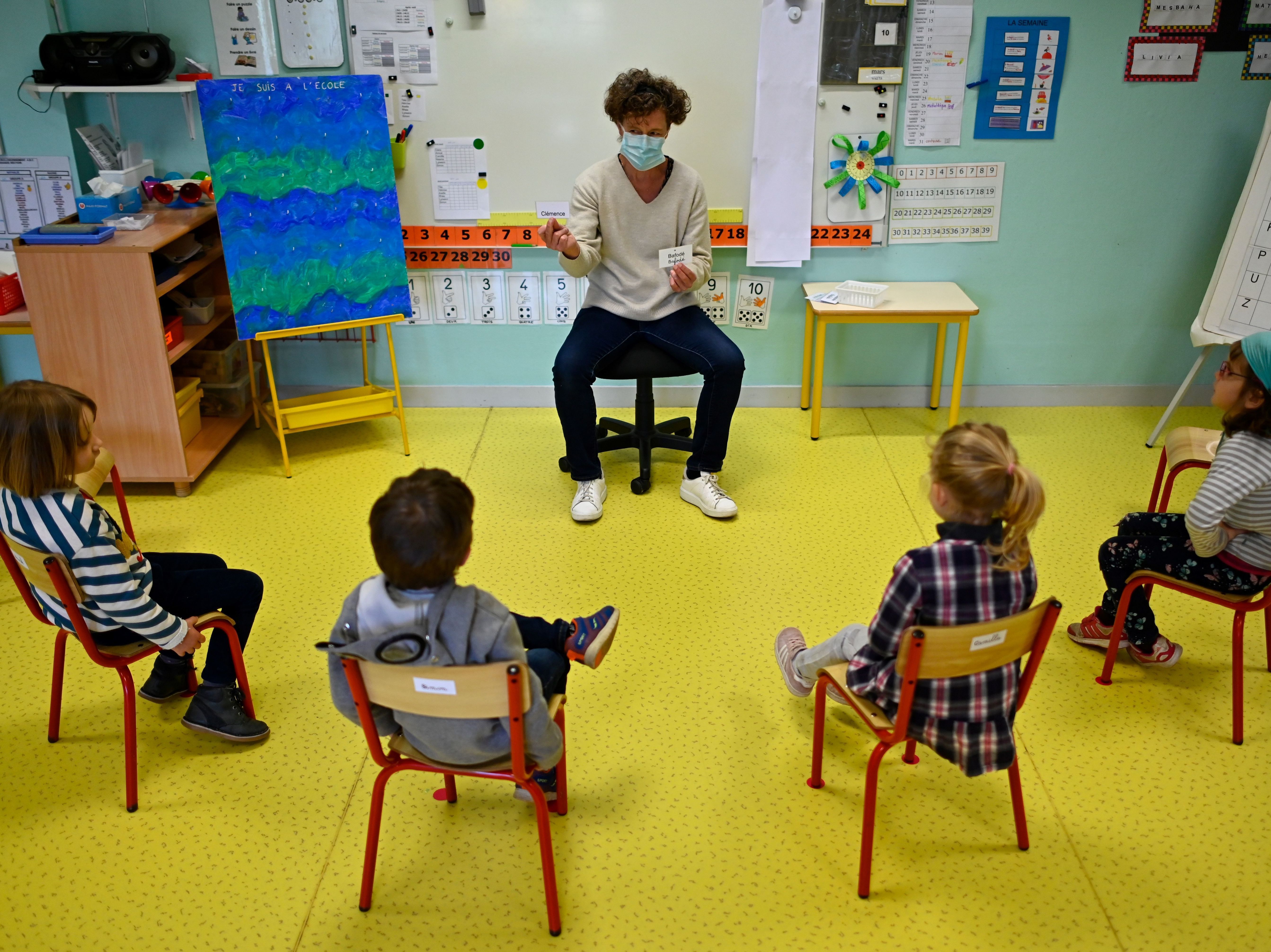To go back or go online? That's the question facing many parents and teachers at the moment. (AFP via Getty Images)