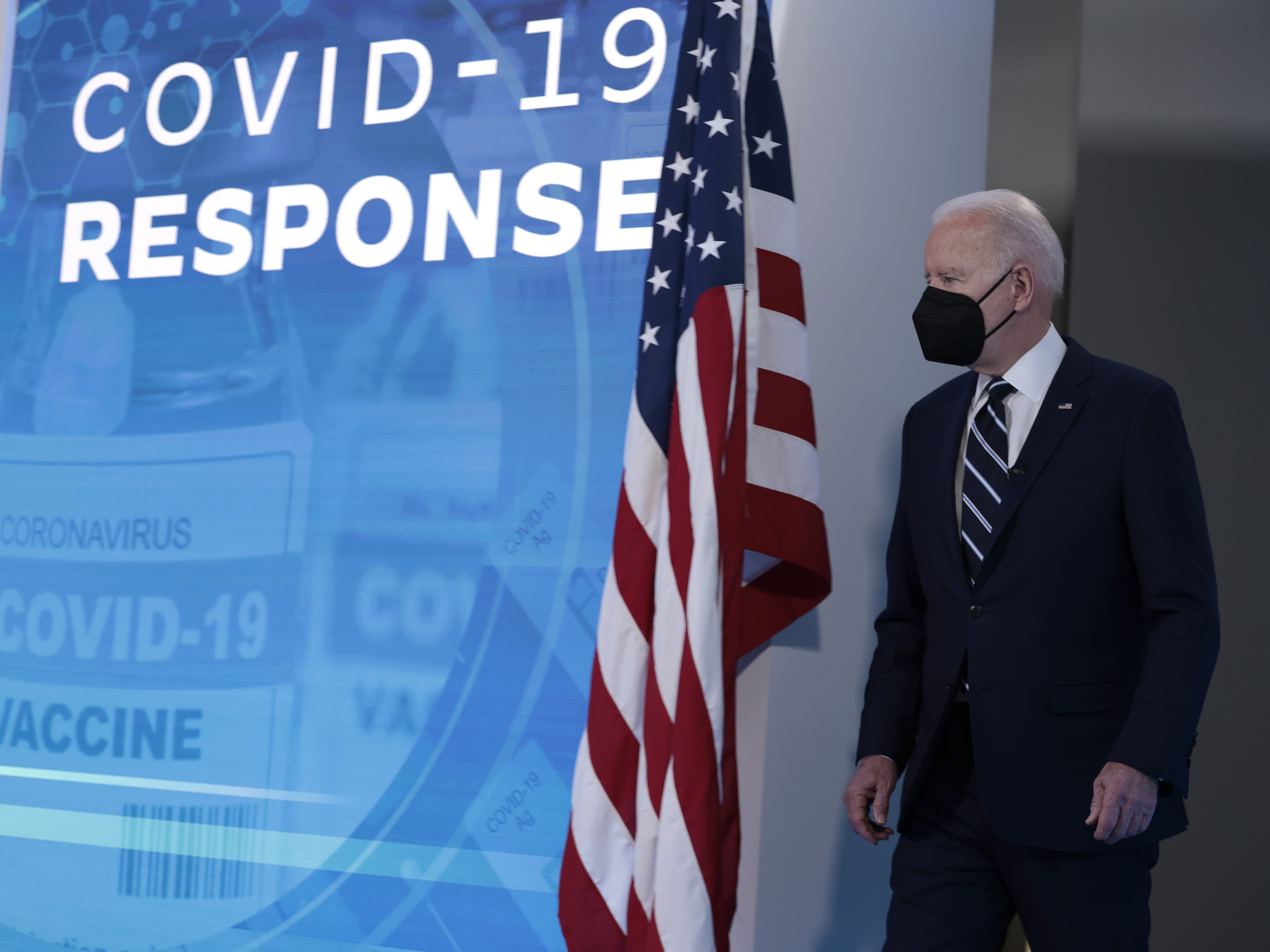 WASHINGTON, DC - JANUARY 13: U.S. President Joe Biden arrives to give remarks on his administration's response to the surge in COVID-19 cases across the country from the South Court Auditorium in the Eisenhower Executive Office Building. (Getty Images)