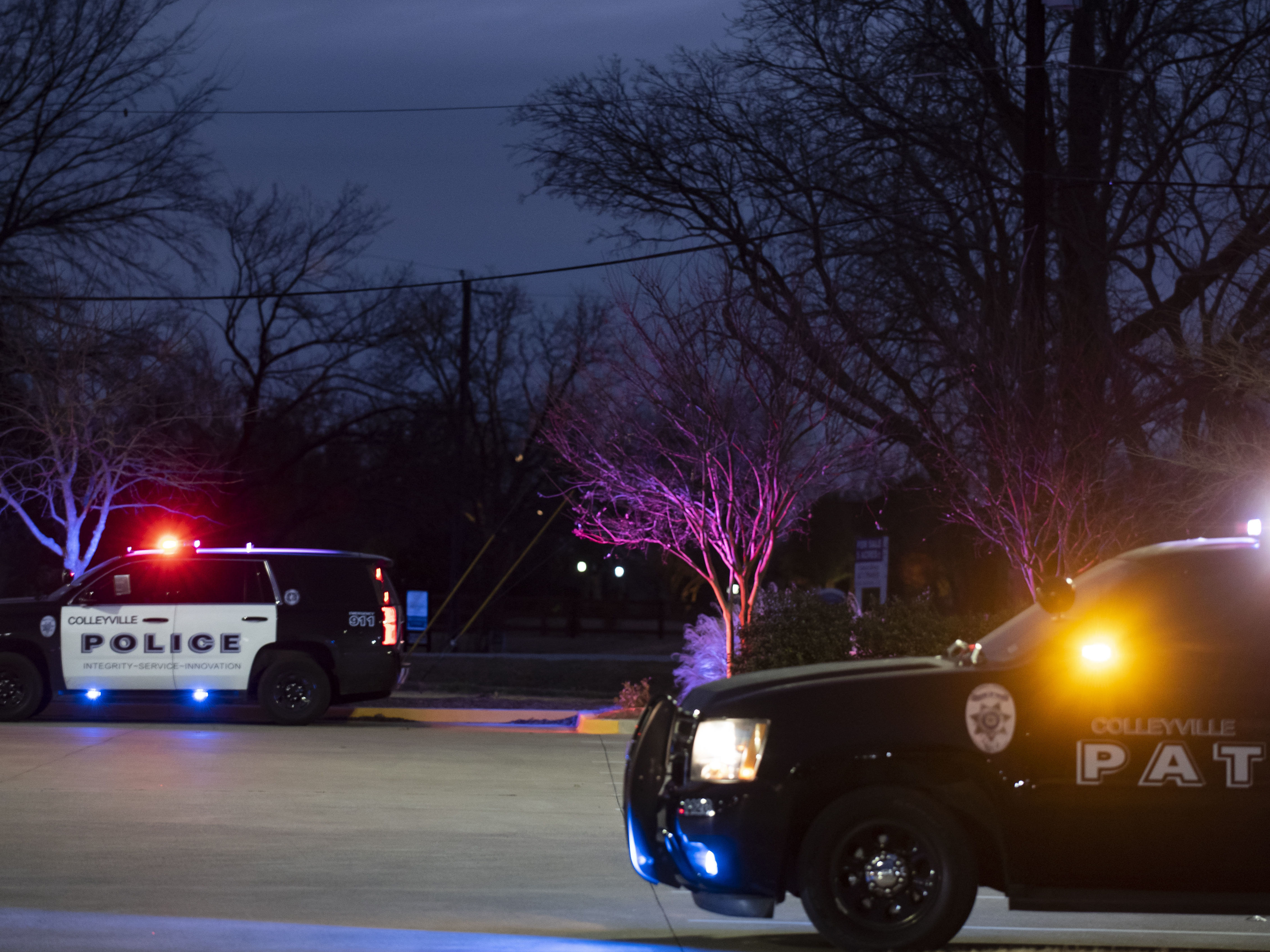 Police cars remain parked at Good Shepherd Catholic Community church on Saturday in Colleyville, Texas. Authorities said all hostages were freed safely. (Getty Images)