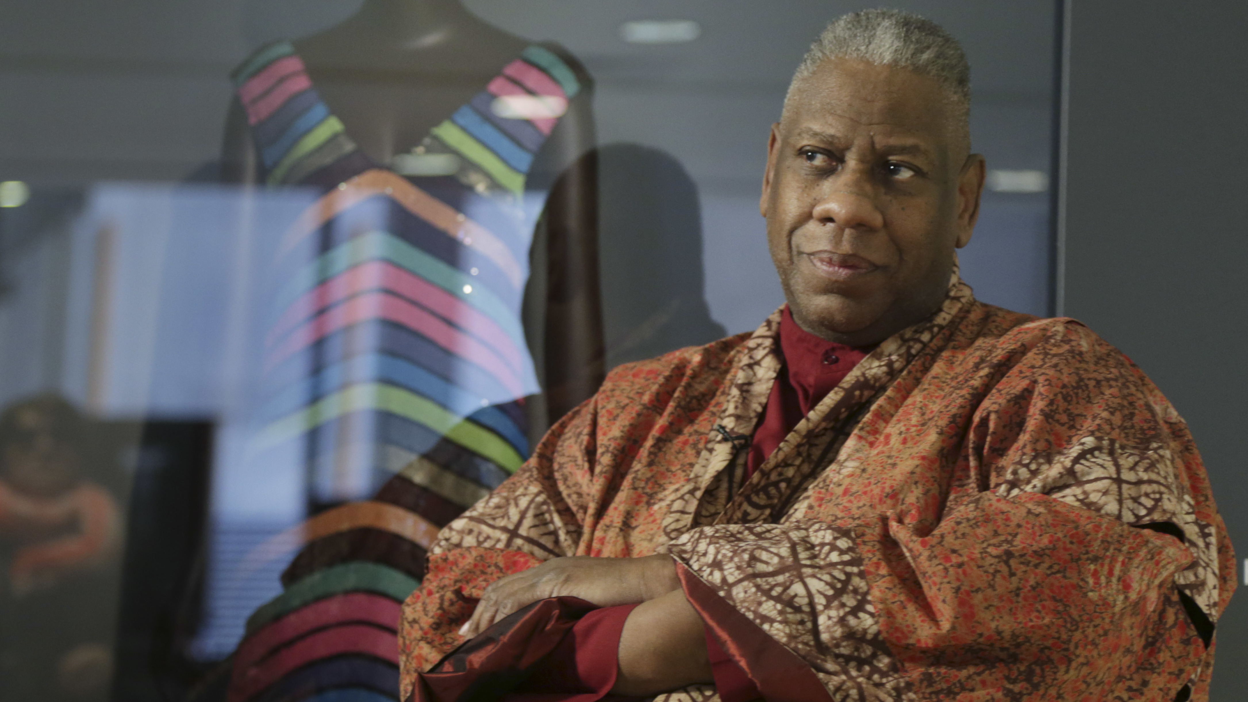 André Leon Talley, a former editor at large for Vogue magazine, speaks to a reporter at the opening of the "Black Fashion Designers" exhibit at the Fashion Institute of Technology in New York on  Dec. 6, 2016.