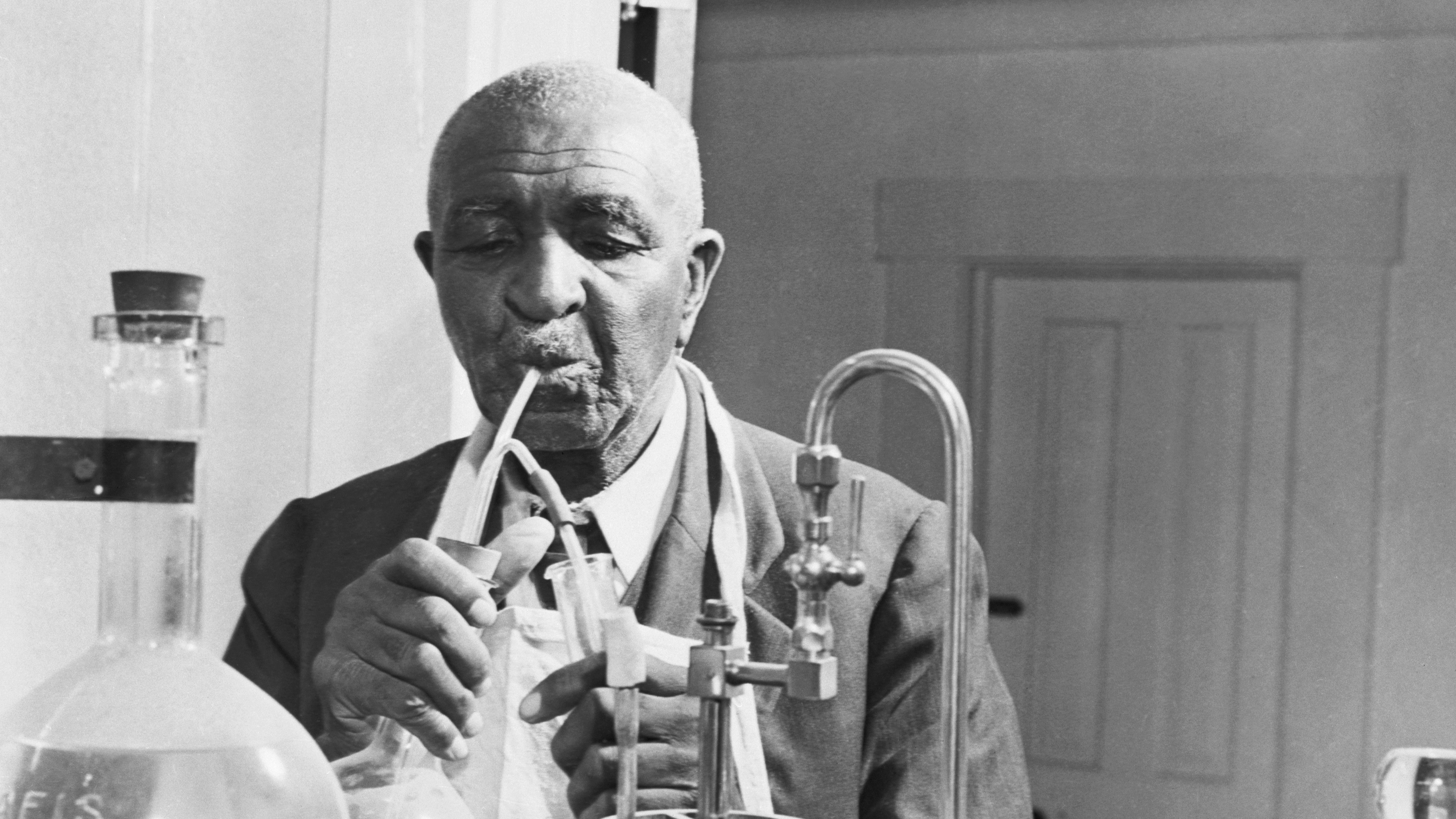 In the lab with George Washington Carver, a prominent soil scientist and inventor of the early 20th Century. (Bettmann Archive)