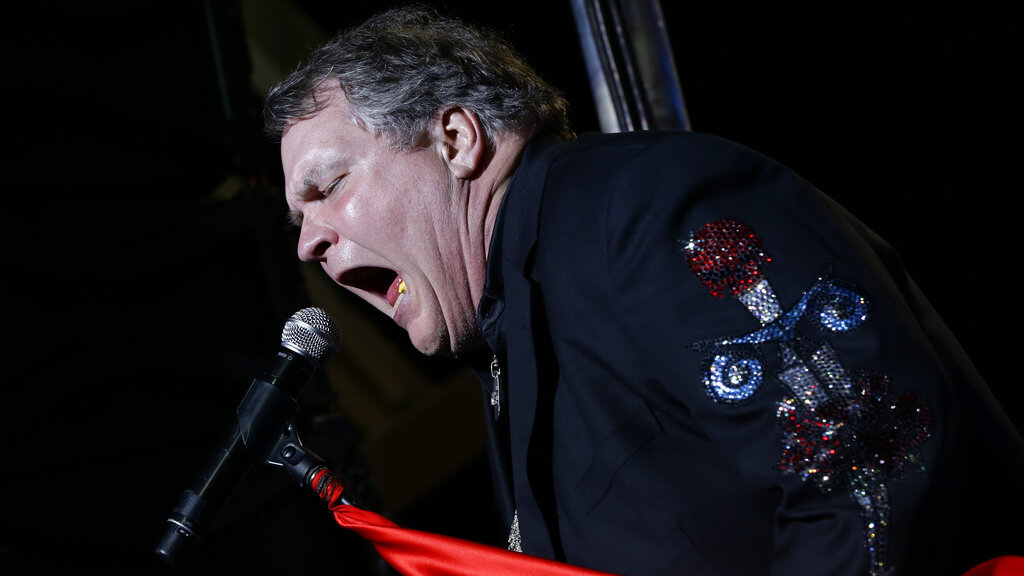 Singer Meat Loaf performs in support of Republican presidential candidate and former Massachusetts Gov. Mitt Romney at the football stadium at Defiance High School in Defiance, Ohio, Thursday, Oct. 25, 2012.