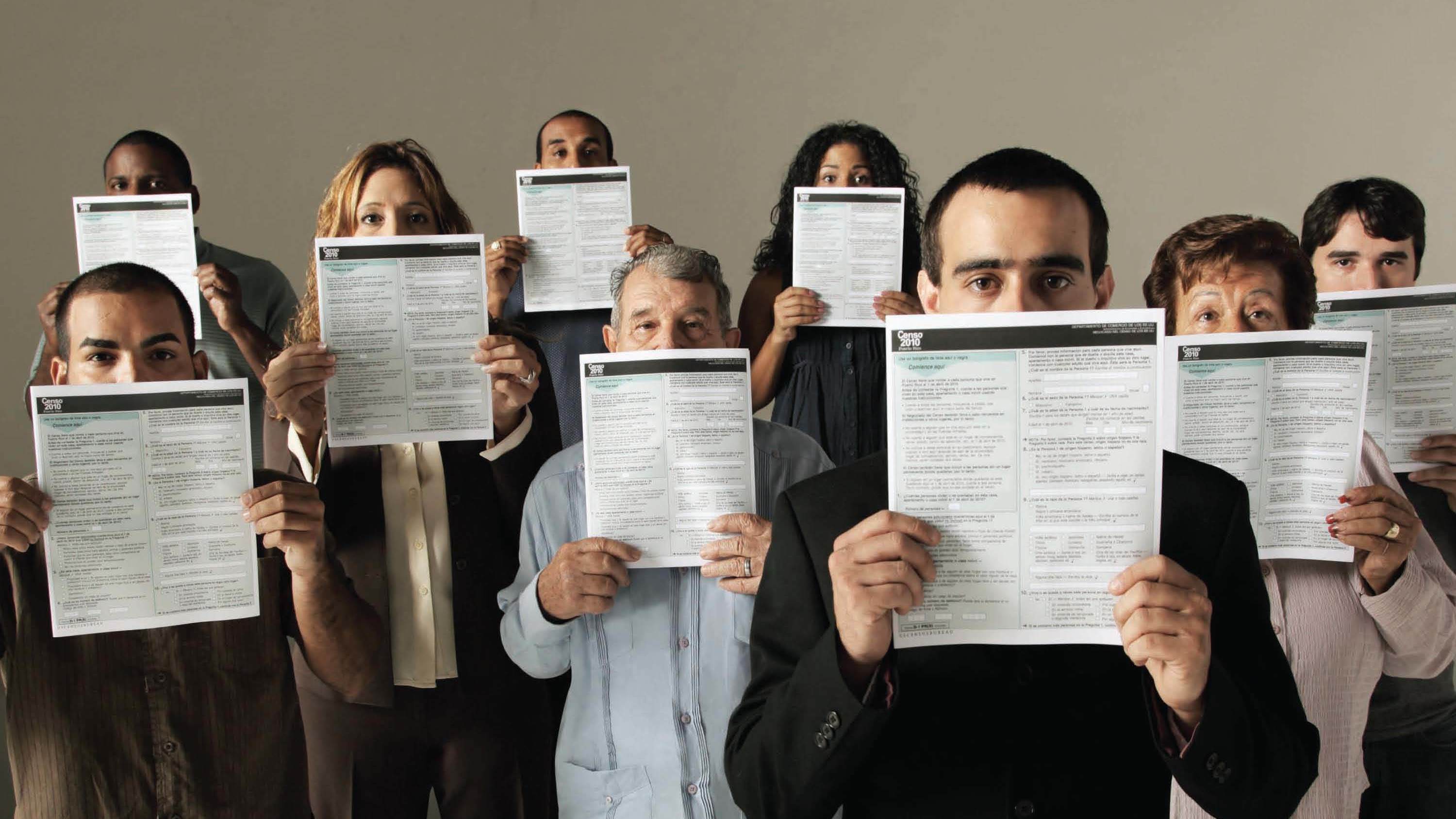 People conceal parts of their faces with forms for the 2010 count in Puerto Rico in a U.S. Census Bureau poster about how it keeps information confidential. Records for the once-a-decade tally cannot be released until 72 years after a count's Census Day. (National Archives)