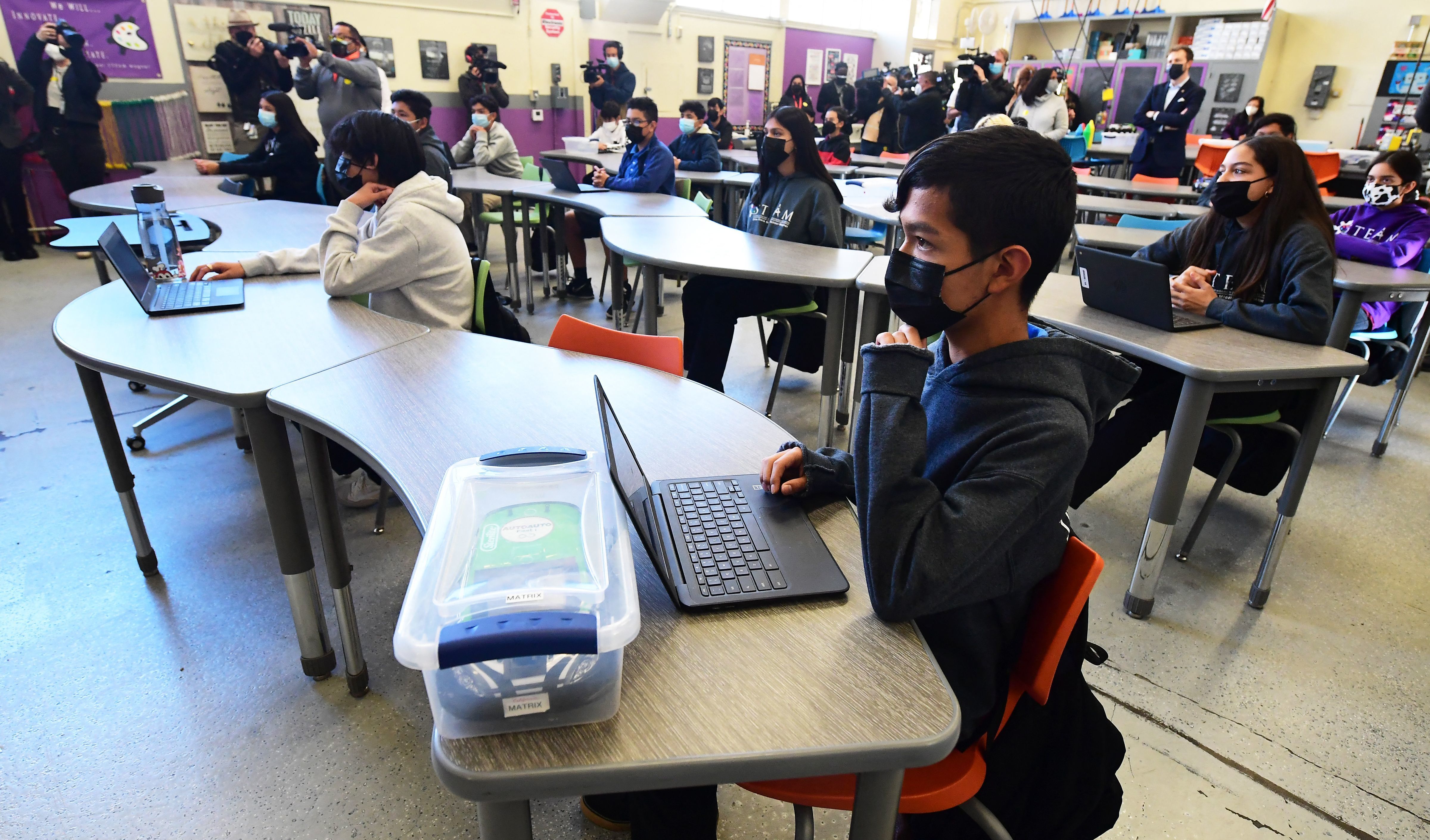 Seventh and eighth grade students attend class at Olive Vista Middle School on Jan. 11 in Sylmar, Calif. Los Angeles students will be required to wear non-cloth masks. (AFP via Getty Images)