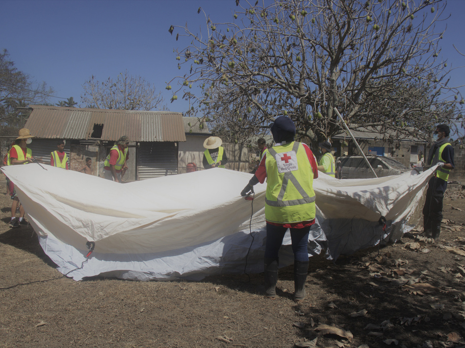 Red Cross teams set up a temporary shelter in Kanokupolu, western Tongatapu, on Friday as the Tonga island group grapples with the aftermath from the recent underwater volcanic eruption. (Tonga Red Cross Society/via AP)
