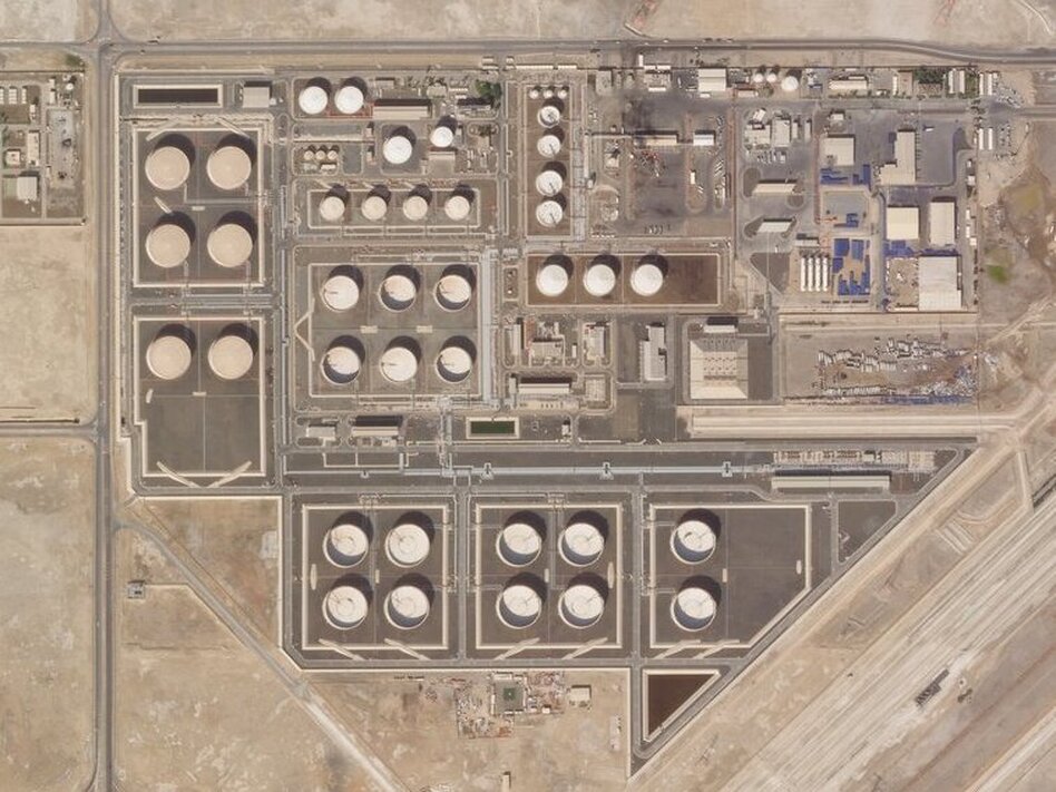 This satellite image provided by Planet Labs PBC shows the aftermath of an attack claimed by Yemen's Houthi rebels on an Abu Dhabi National Oil Co. fuel depot in the Mussafah neighborhood of Abu Dhabi, United Arab Emirates, Saturday, Jan. 22, 2022.