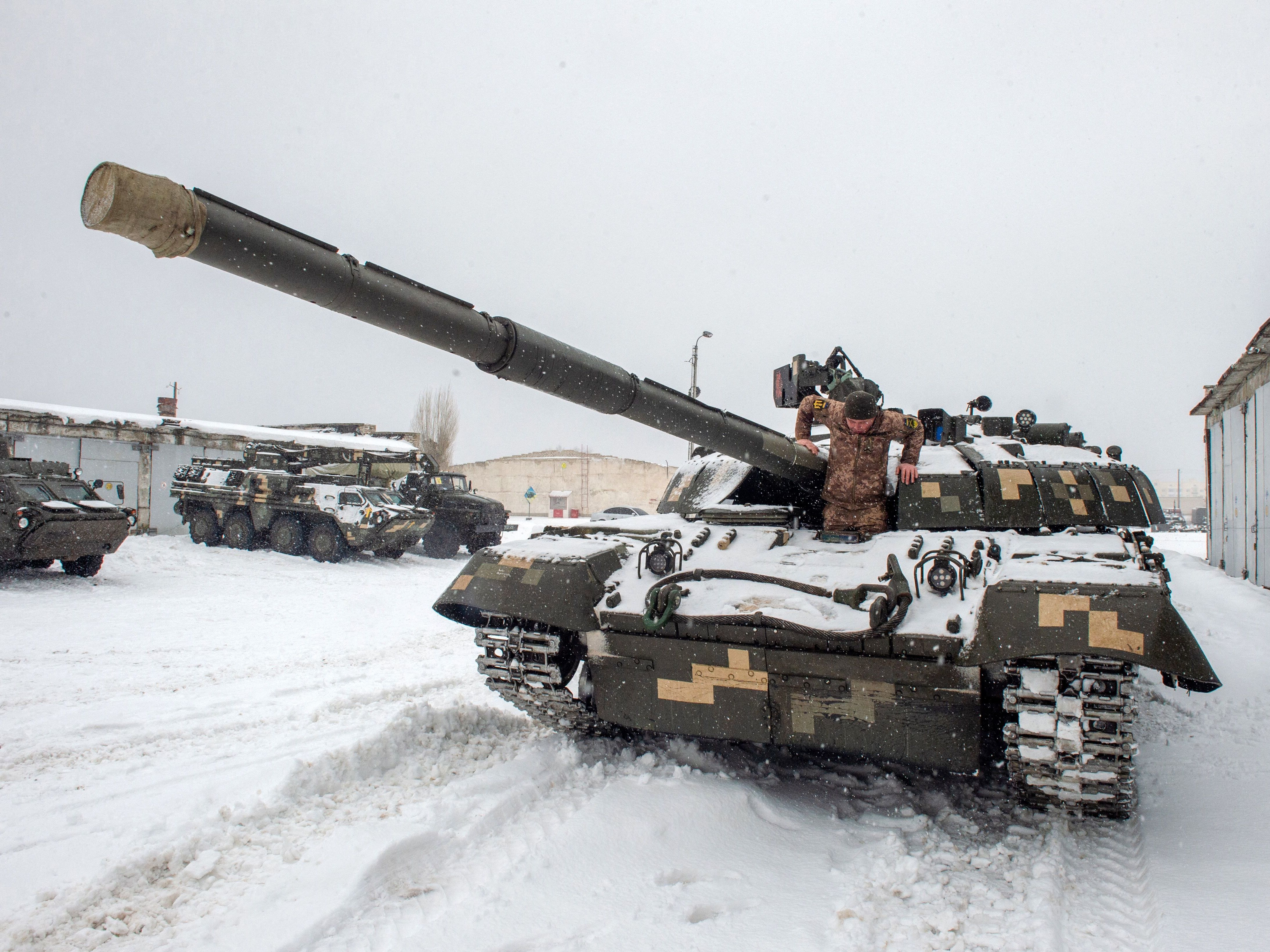 A Ukrainian military forces serviceman gets out of a tank parked in a base near Klugino-Bashkirivka village in the Kharkiv region on Monday. (AFP via Getty Images)