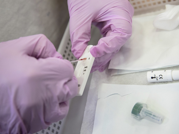 Antibody tests are becoming more available in drugstores, but what do the results really tell you? Above: A Paris pharmacist deposits a blood sample for a COVID-19 antibody test.