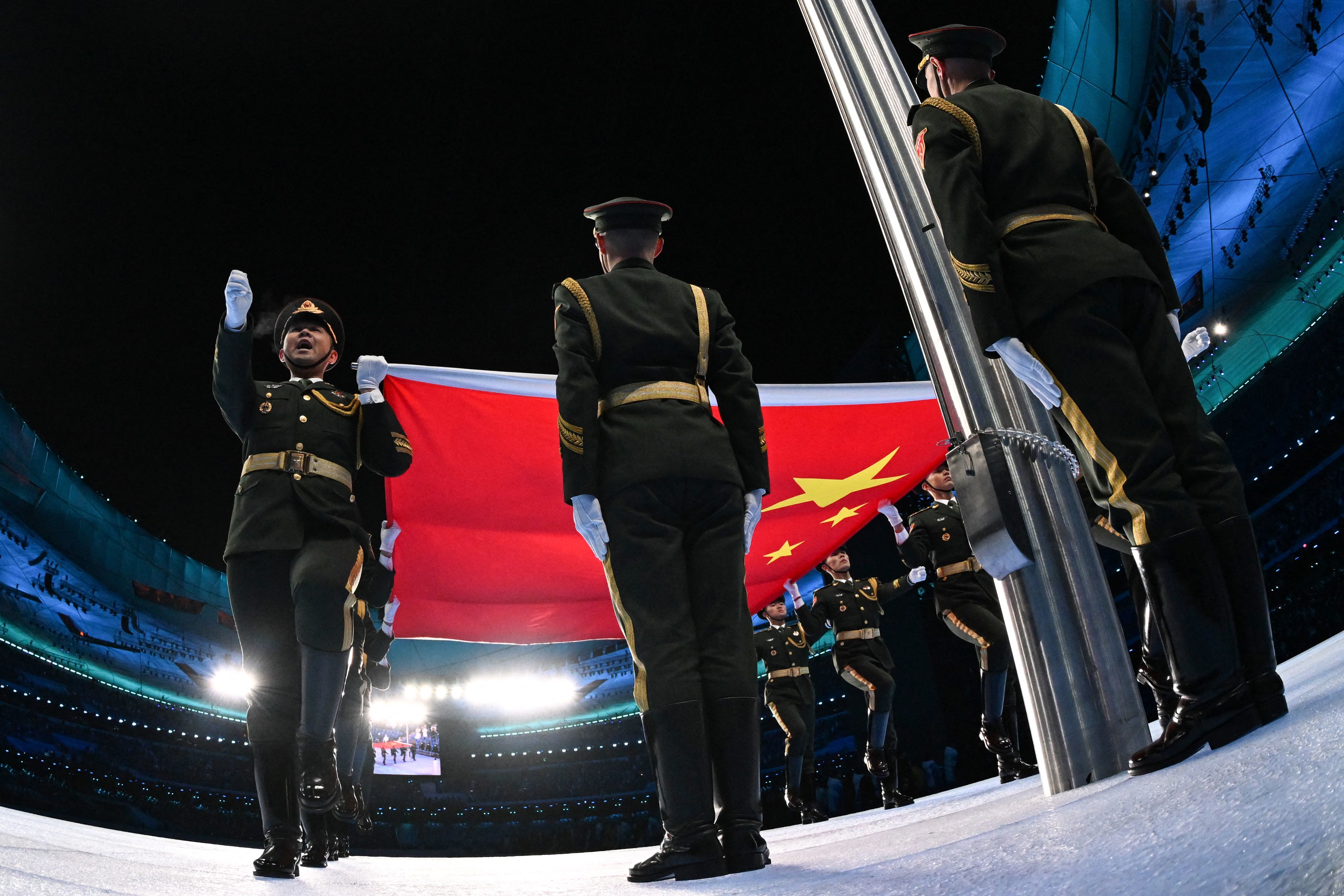 The Winter Games have begun. See photos and highlights from the opening ceremony 2 The Chinese national flag is raised during the Winter Games' opening ceremony at the National Stadium, known as the Bird's Nest.
