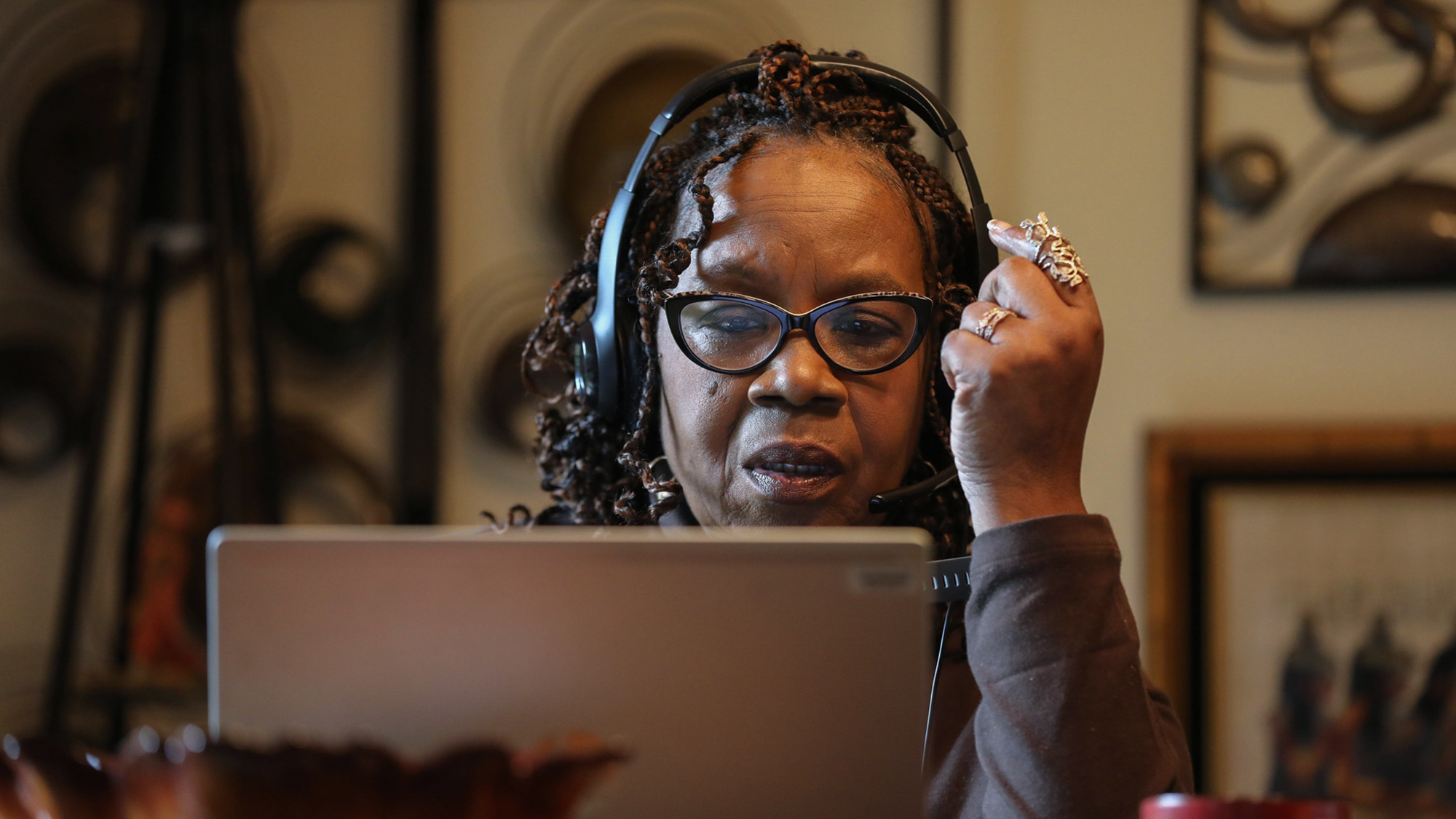 Contact tracing programs around the country have been struggling to keep up with demand during the last several coronavirus surges. Here, contact tracer Cherie Hunter puts works from her home in Tinley Park, Ill., to reach people who have tested positive for COVID-19.