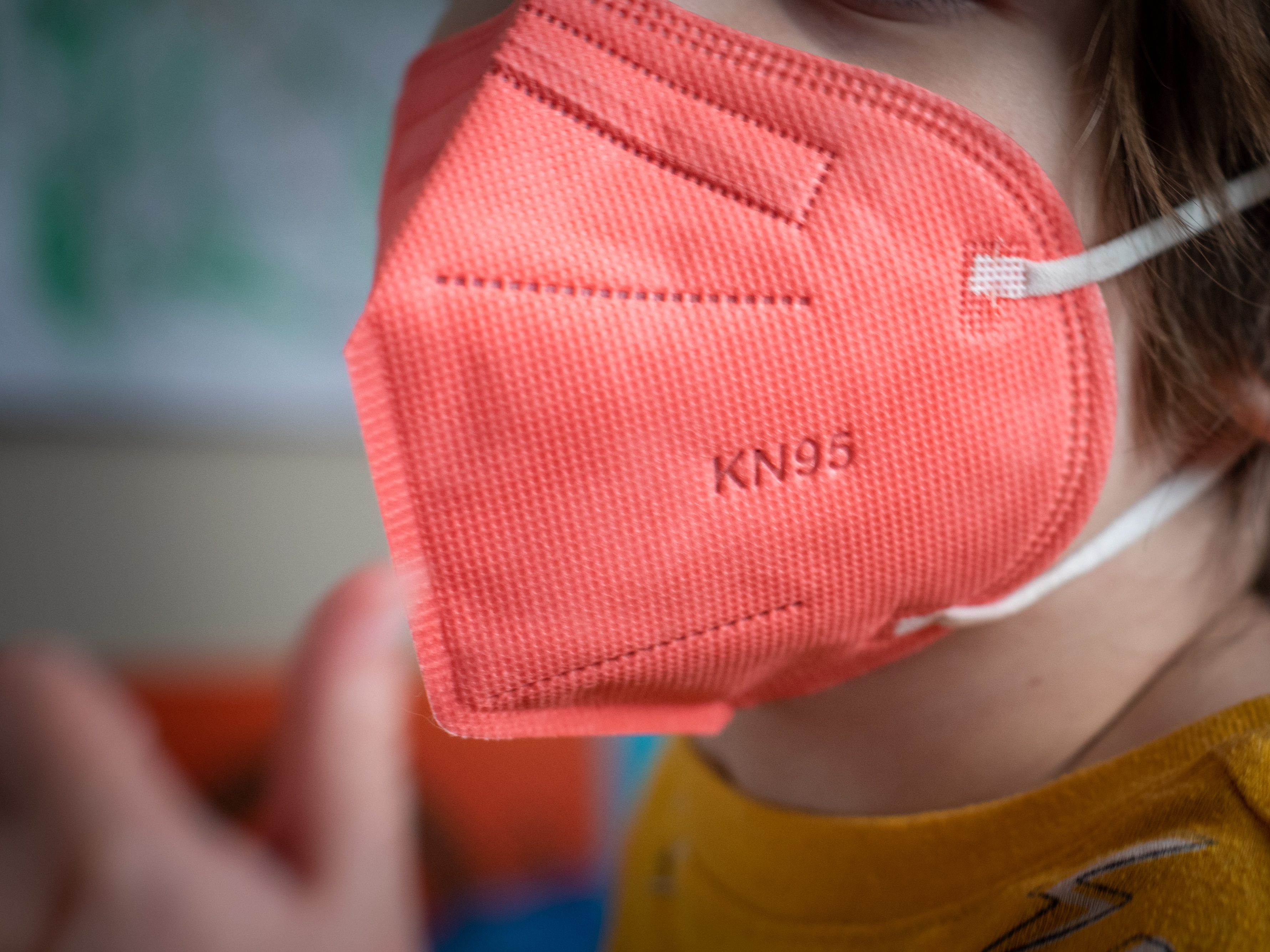 A child wears a KN95 mask for kids in Hastings-on-Hudson, New York. (Tiffany Hagler-Geard/Bloomberg via Getty Images)
