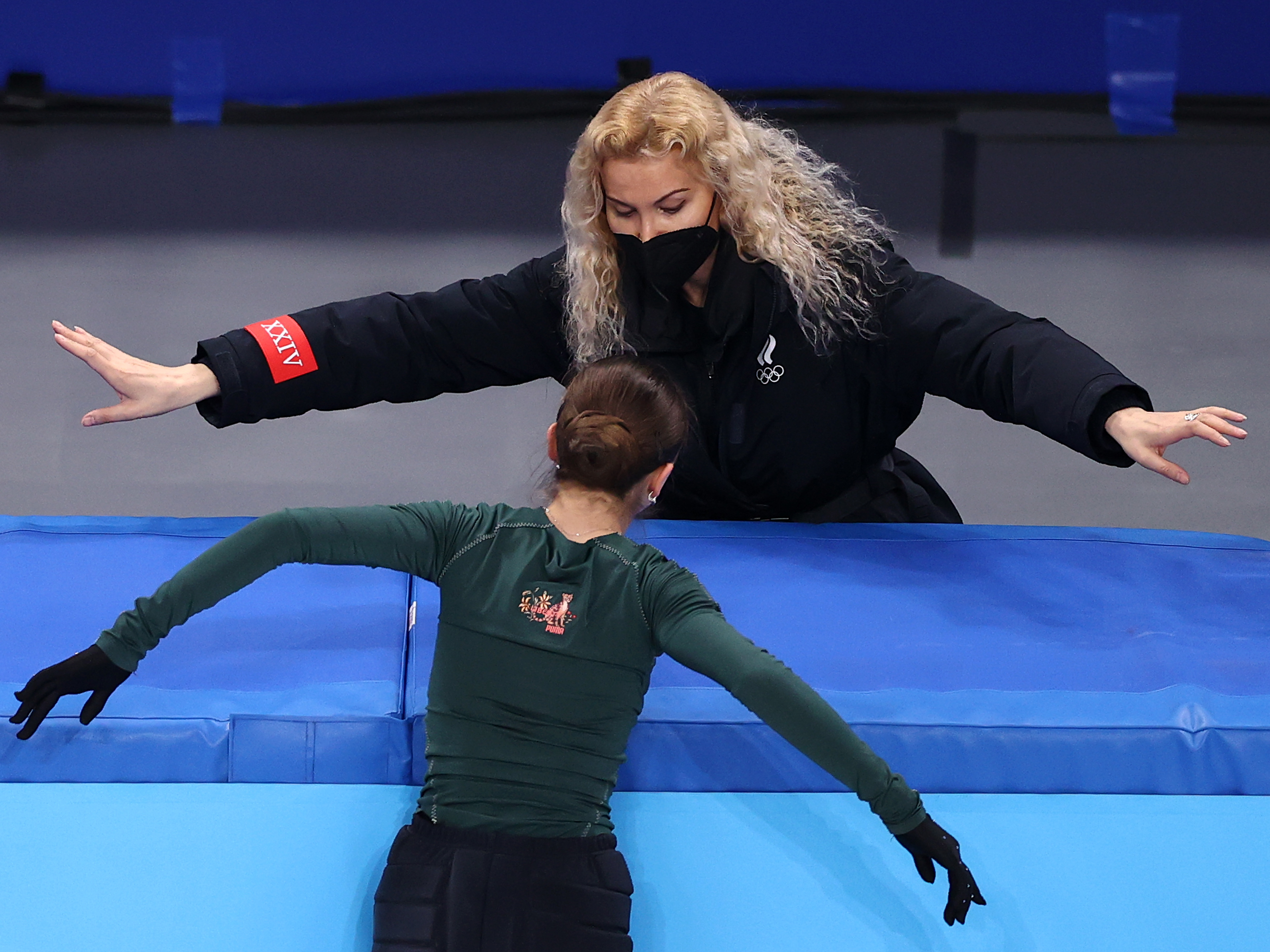Kamila Valieva of Team ROC pictured with her coach, Eteri Tutberidze during a training session at the Beijing Olympics on February 13, 2022.