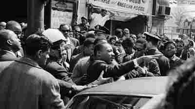 To honor her dad's legacy, she's sharing his historic photos of MLK, Jackie O and more