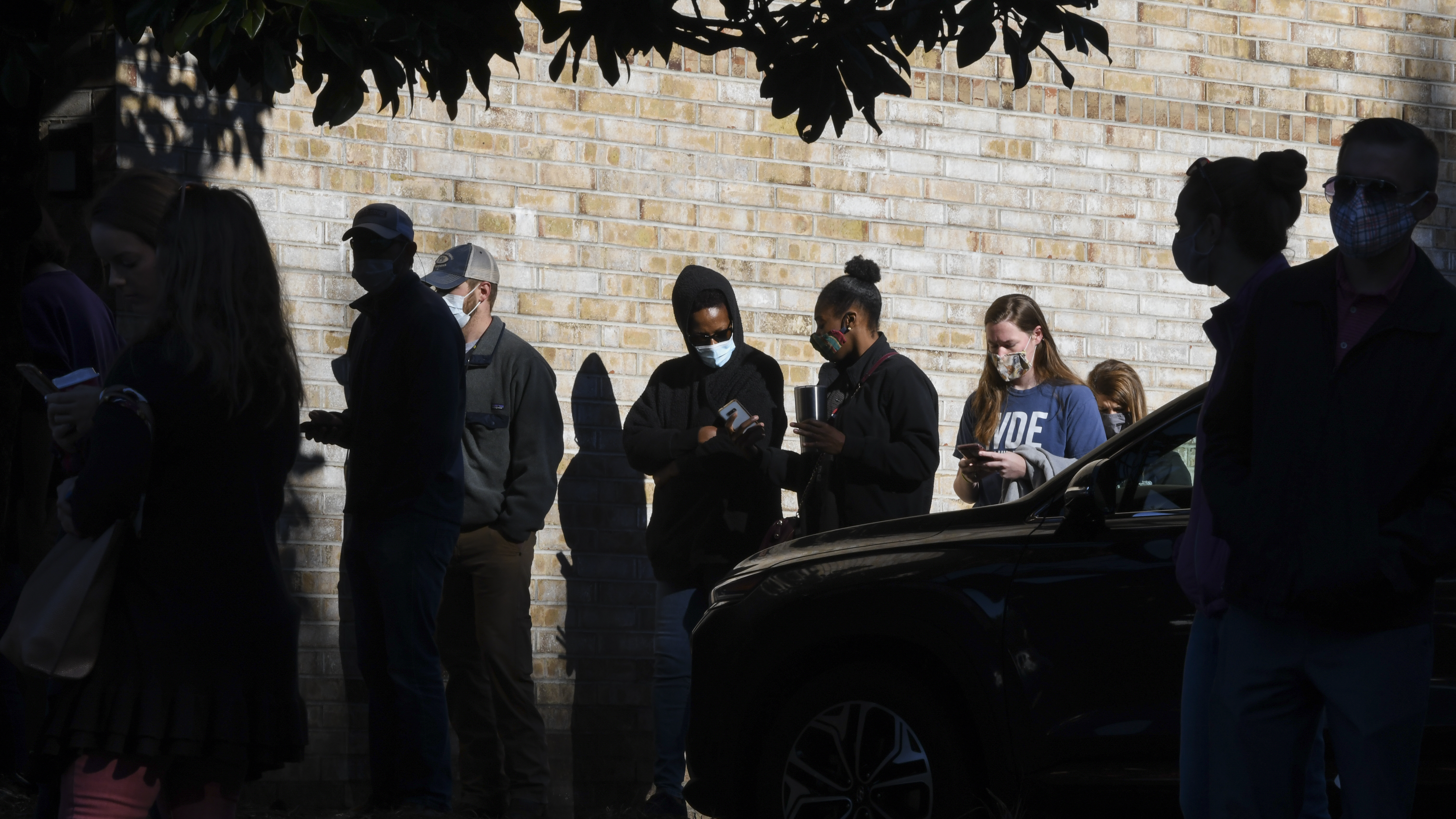 Voters wait in line to cast their ballots in the 2020 election on Nov. 3, 2020, in Auburn, Ala.