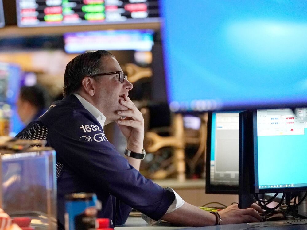 Traders work on the floor of the New York Stock Exchange at the opening bell on Tuesday in New York. Stocks tumbled on Thursday after Russia invaded Ukraine, sending the Nasdaq into what's known as a bear market. (AFP via Getty Images)