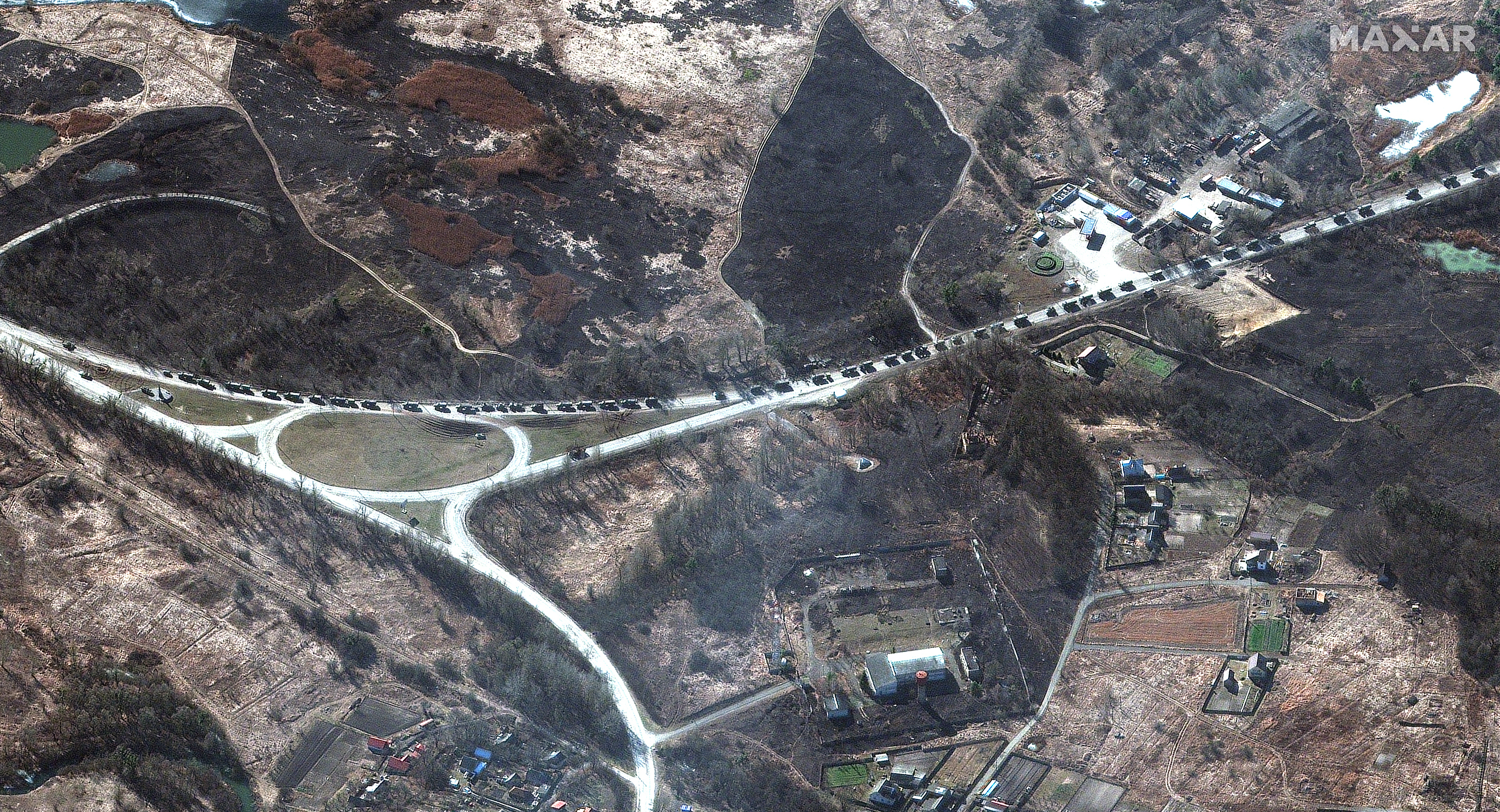 Satellite images show a Russian military convoy north of Kyiv. (Maxar)