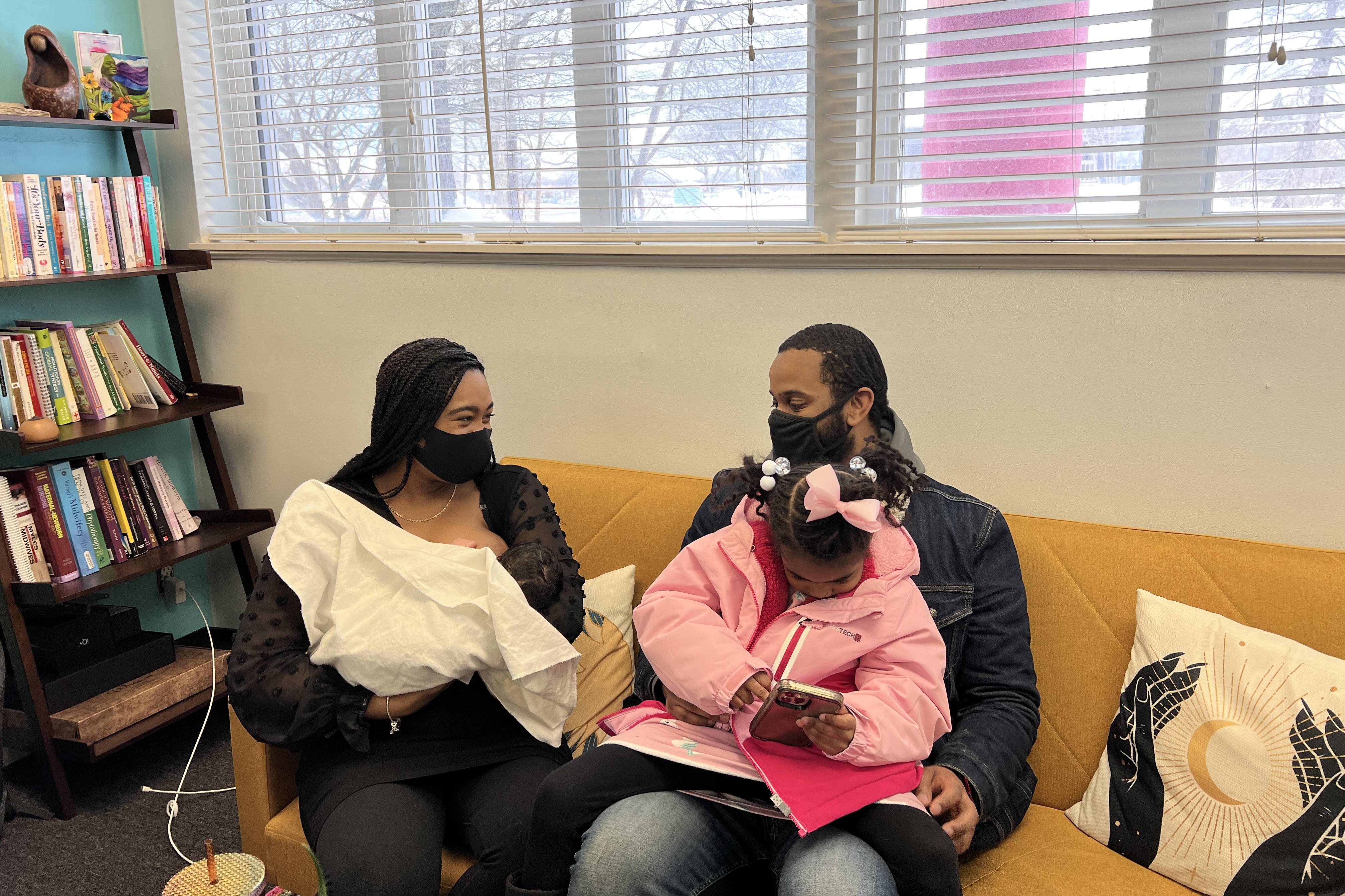 Nova and Deontre Williams-Laster, at their first check up with their midwife since giving birth at home. (Michelle Jokisch Polo/NPR)