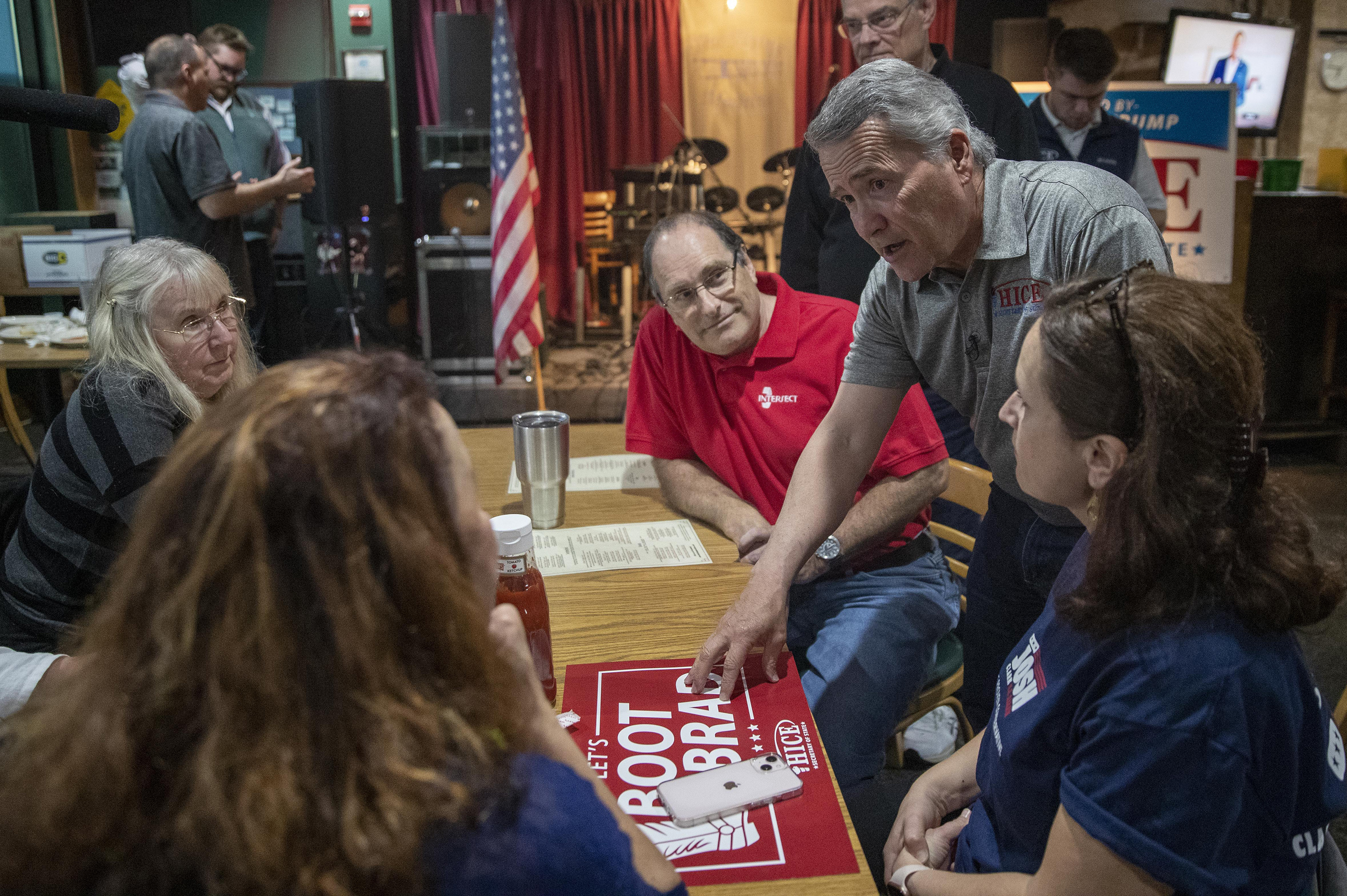 Rep. Jody Hice, R-Ga., speaks with supporters during a campaign event at the Flying Machine restaurant in Lawrenceville, Ga. Hice, one of the nation's preeminent election deniers, is running for Georgia secretary of state. (Alyssa Pointer for NPR)